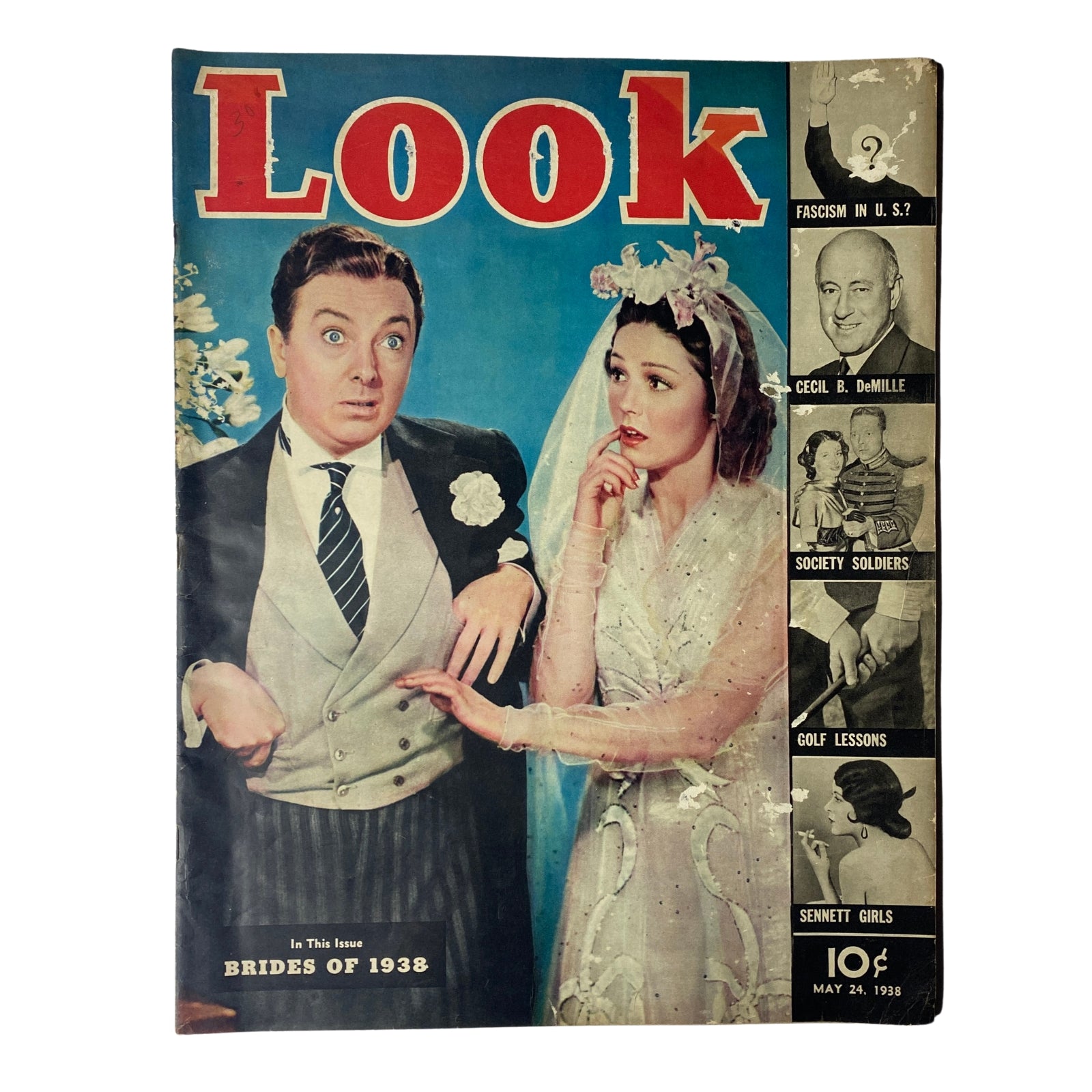 Cover of Look Magazine dated May 24, 1938 featuring the title 'The Brides of 1938', showcasing a wedding scene with a surprised groom and a bride in a vintage wedding dress, capturing the style and themes of early 20th century bridal fashion.