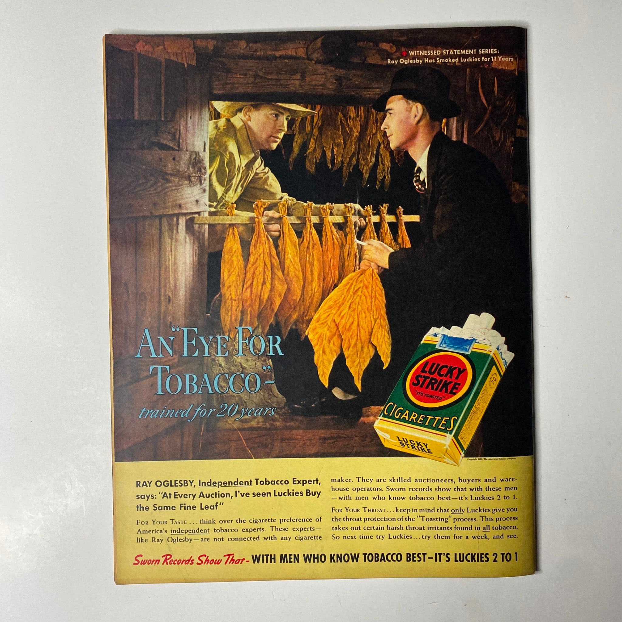 Back cover of Look Magazine, June 21, 1938, showing an advertisement for Lucky Strike cigarettes with two men discussing tobacco, emphasizing the quality of tobacco products.