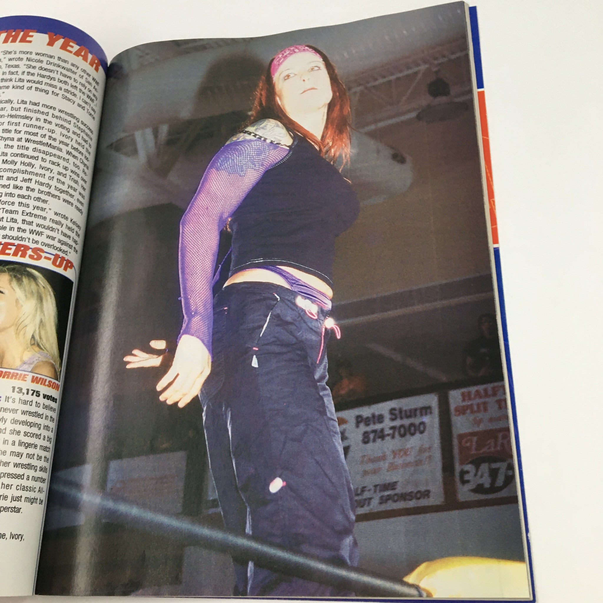Image from Pro Wrestling Illustrated Magazine April 2002 featuring a female wrestler in action, showcasing the vibrant atmosphere of professional wrestling.