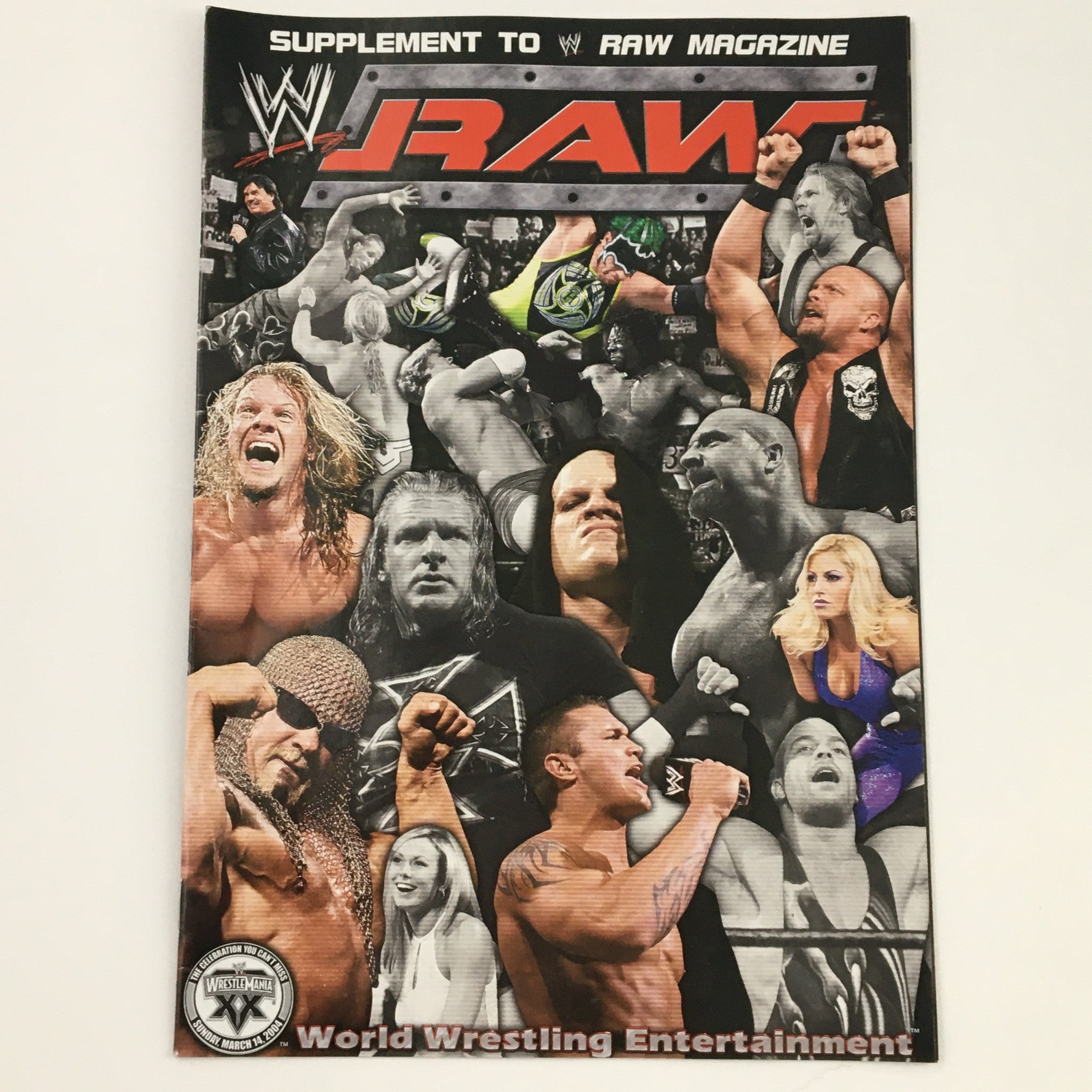 Cover of WWE Raw Magazine 2003 featuring multiple wrestling stars including Edge, Randy Orton, and Trish Stratus. This vintage magazine captures the excitement of WWE's Monday Night Raw, showcasing iconic figures from professional wrestling.