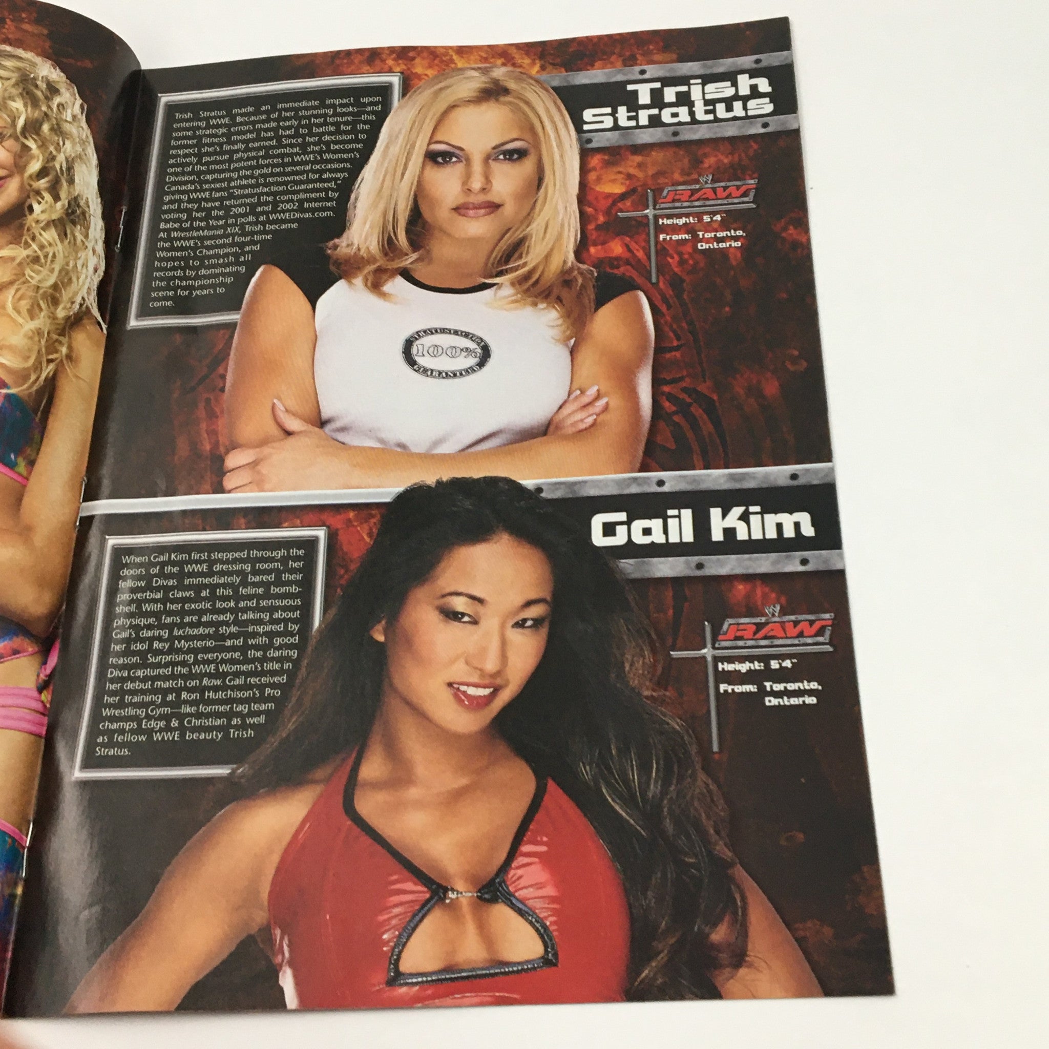 WWE Raw Magazine 2003 featuring Trish Stratus and Gail Kim, showcasing their profiles and images, highlighting female wrestling talent during WWE's iconic era.