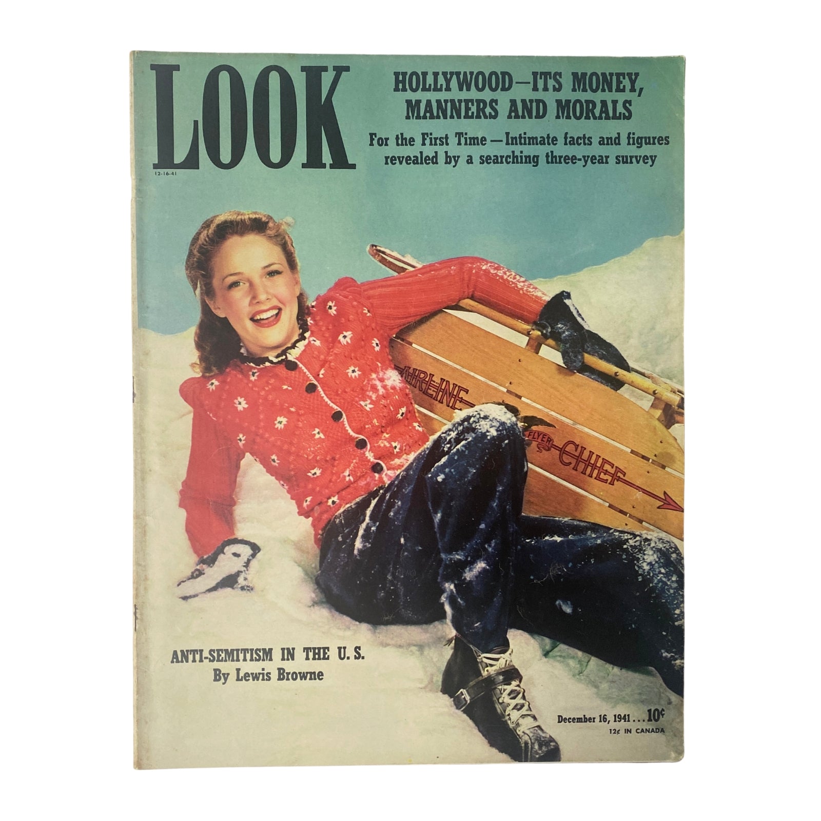 Look Magazine December 16, 1941 cover featuring a vibrant winter scene with Barbara Britton wearing a red snow outfit, showcasing 1940s Hollywood charm and seasonal style.