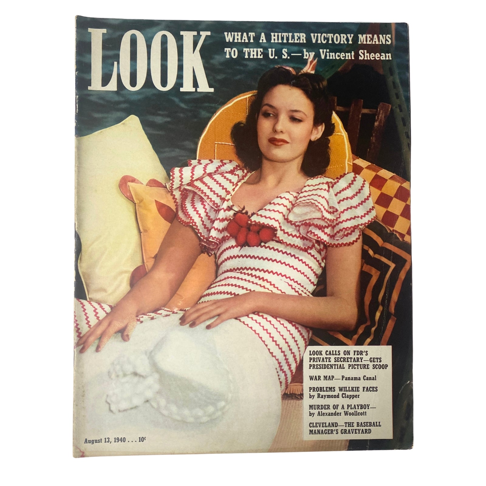 Cover of Look Magazine, August 13, 1940, featuring an article titled 'What a Hitler Victory Means to the U.S.' by Vincent Sheean, showcasing a woman in a striking striped dress against a vivid background.