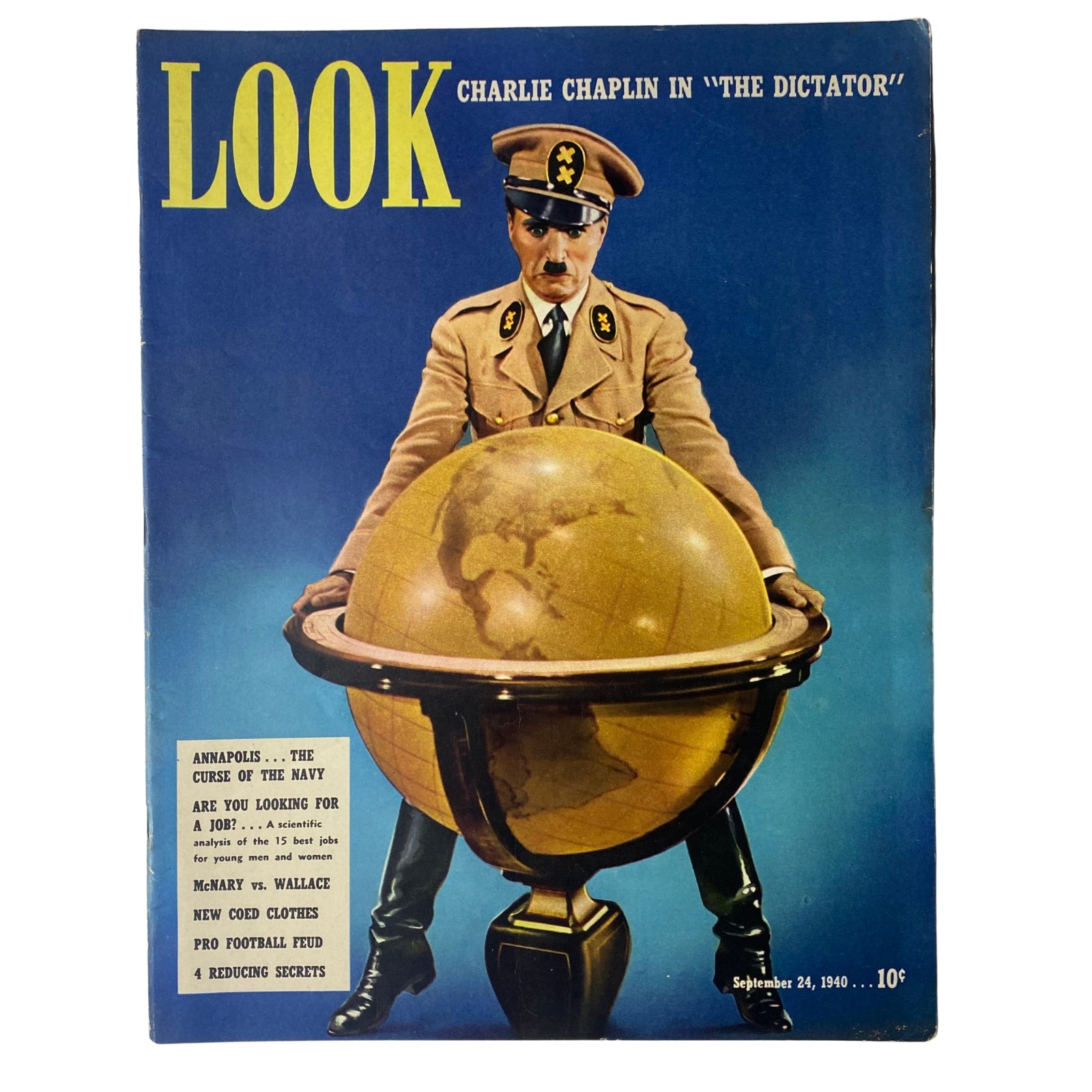 Cover of Look Magazine dated September 24, 1940 featuring Charlie Chaplin in a military uniform standing on top of a globe, promoting his movie 'The Great Dictator'. A vintage magazine in very good condition.