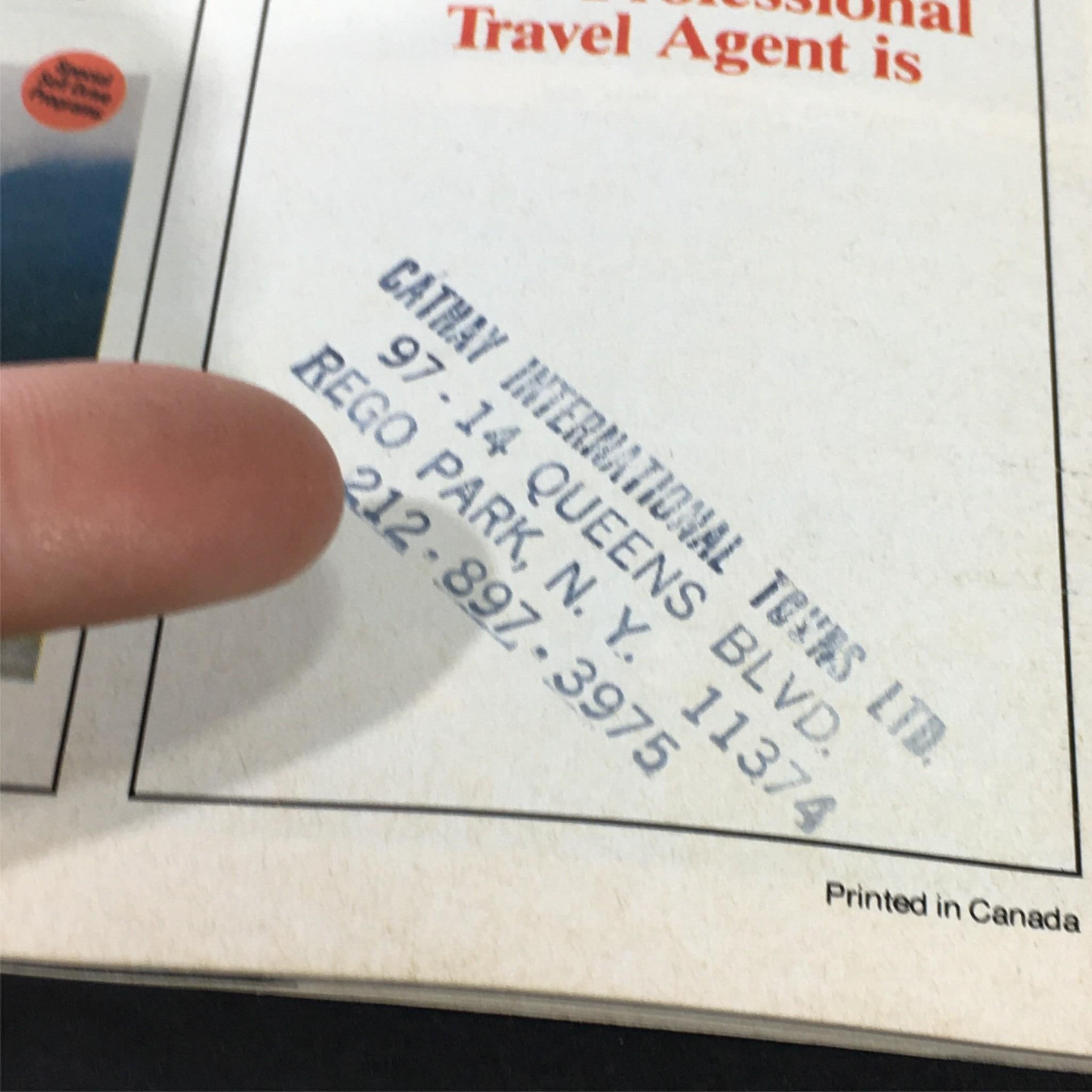 Close-up of the contact information for Cathay International Tours on the back cover of the 1986 Brendan Tours magazine, detailing address and phone number for travel inquiries.