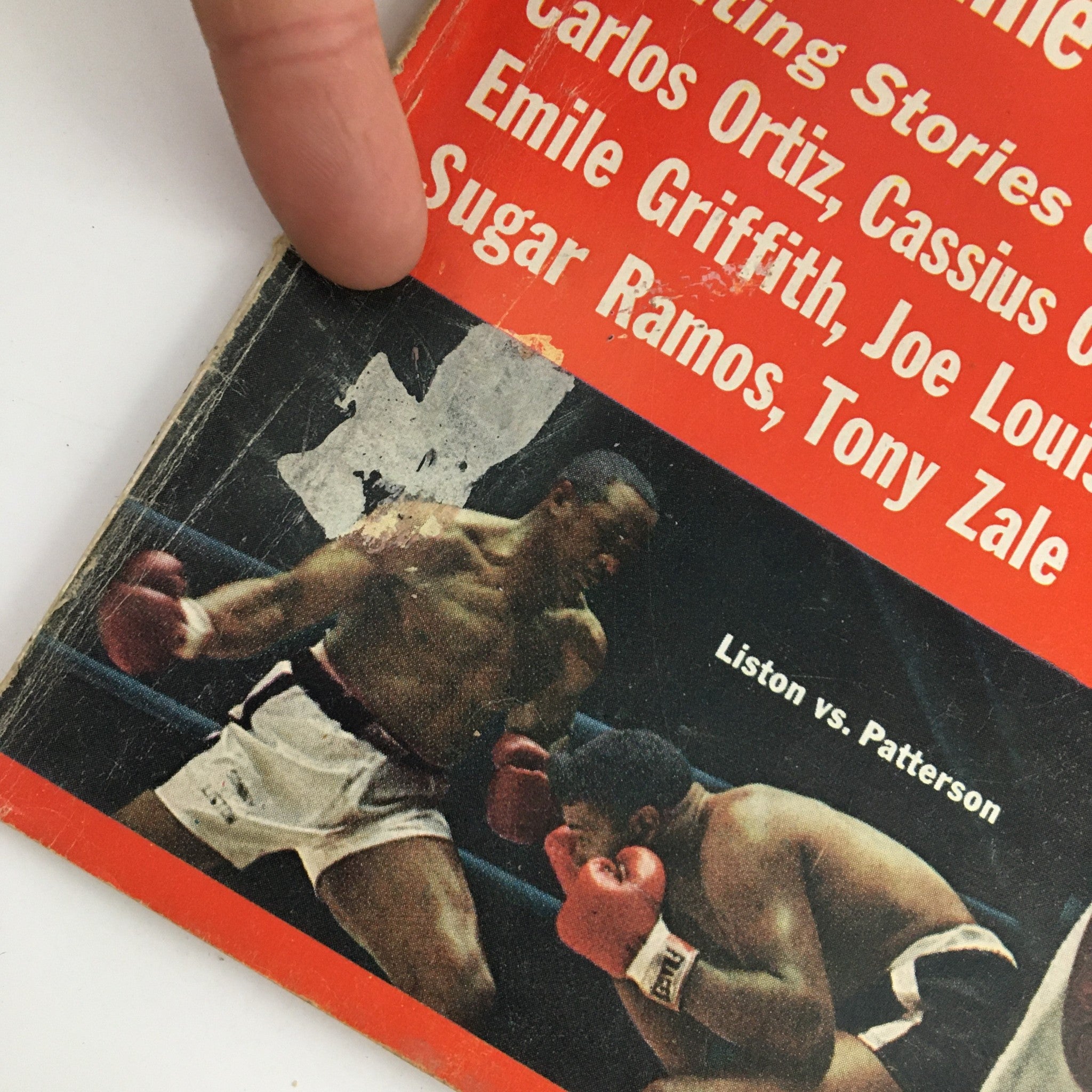 Detailed look at the corner of the True Magazine 1964 Boxing Yearbook, featuring an action shot of the boxing match between Sonny Liston and Floyd Patterson, emphasizing the historical significance of the fight.