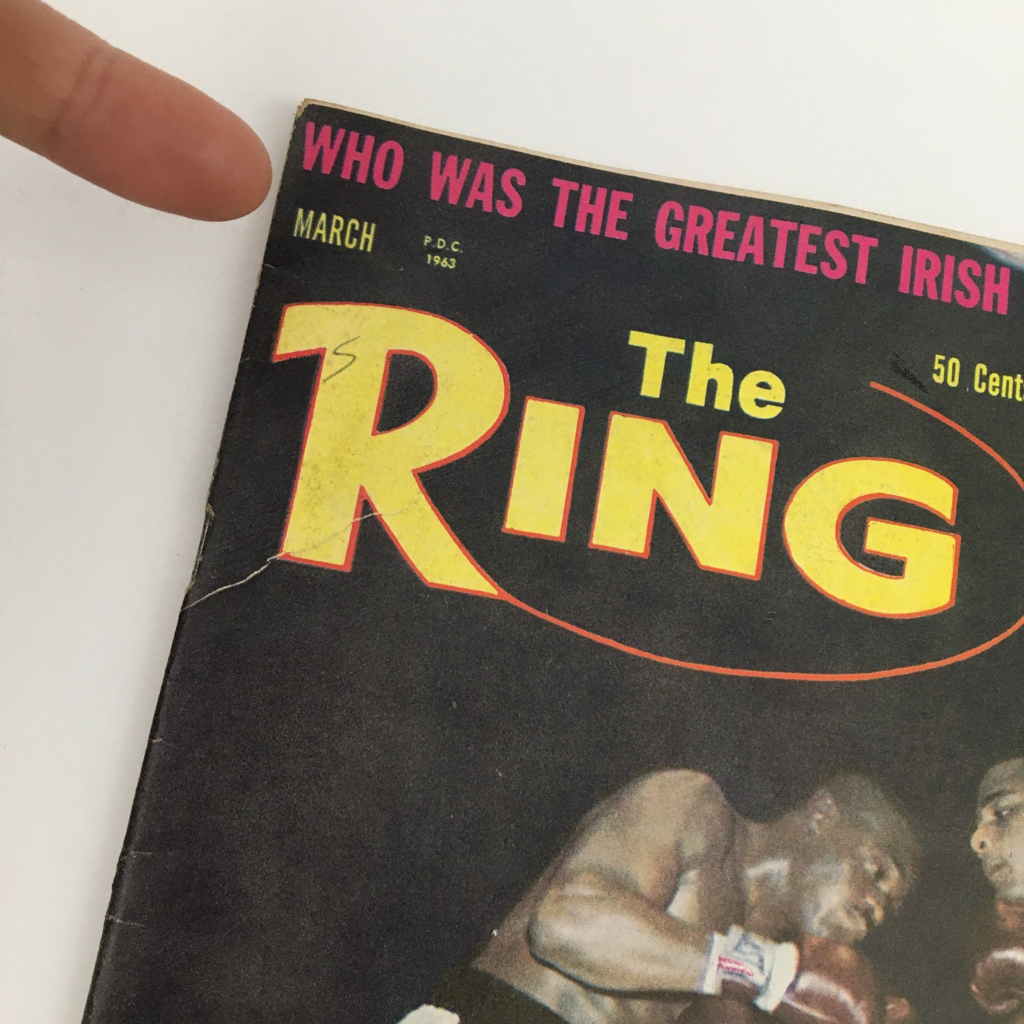 Cover of The Ring Boxing Magazine from March 1963 featuring Doug Jones vs Zora Folley, showcasing a boxing match with bold title and vintage graphics.