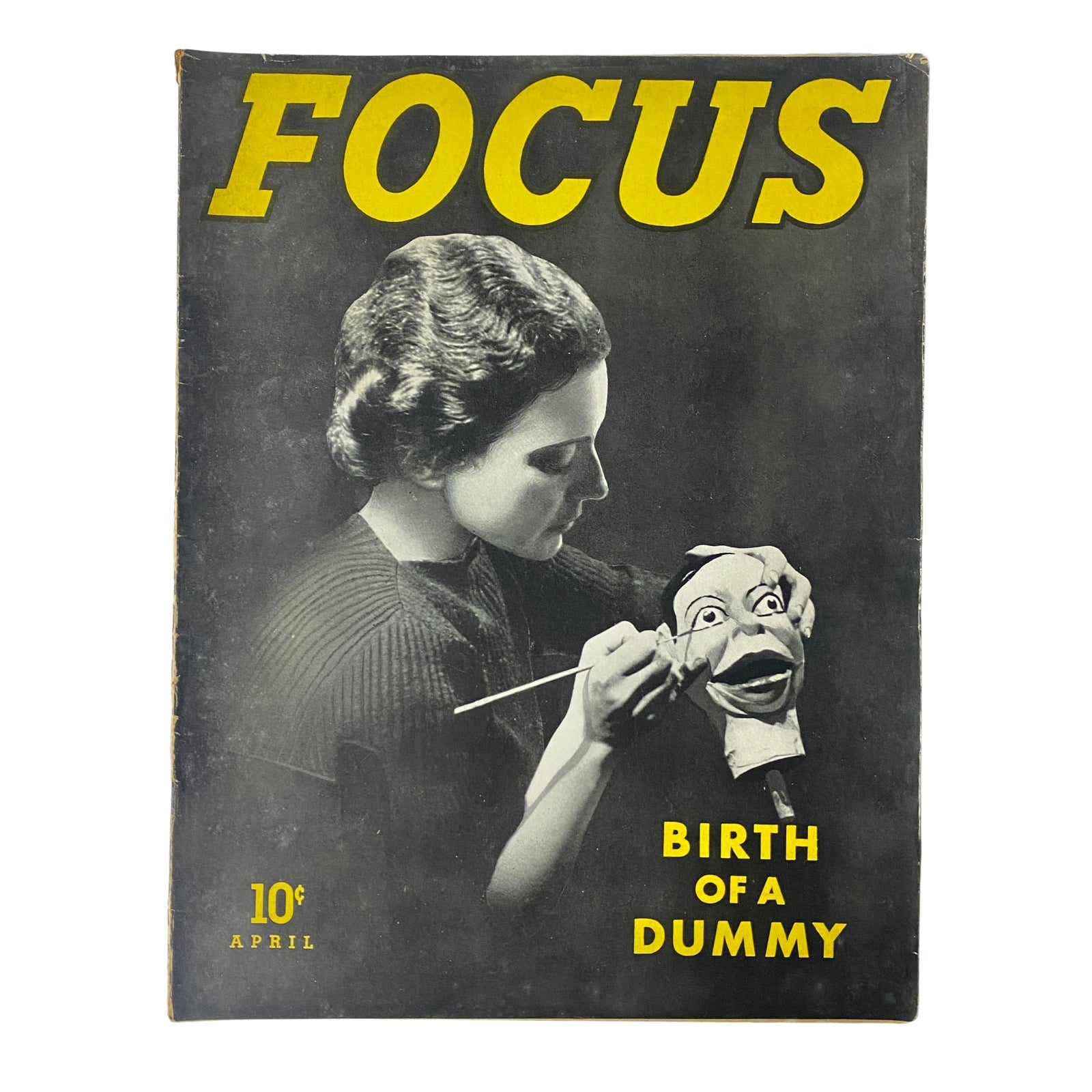 Focus Magazine April 1938 Vol 1 No. 1 featuring the cover story 'Birth of a Dummy', showcasing a woman painting a puppet's face, capturing a significant moment in mid-Depression-era publishing.