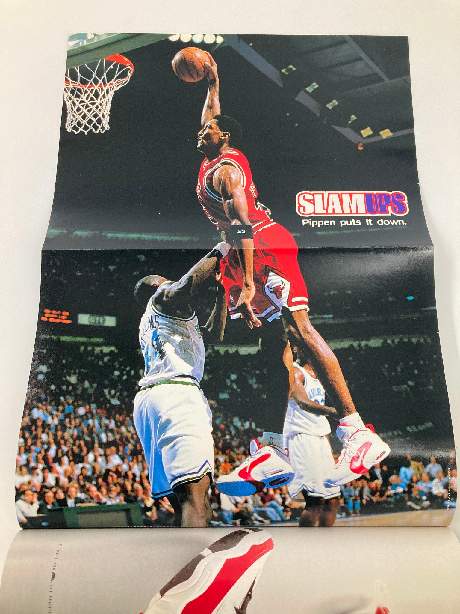 Slam Magazine October 1996 poster of Scottie Pippen performing a slam dunk titled 'Pippen puts it down', one of the featured images in this vintage NBA issue.