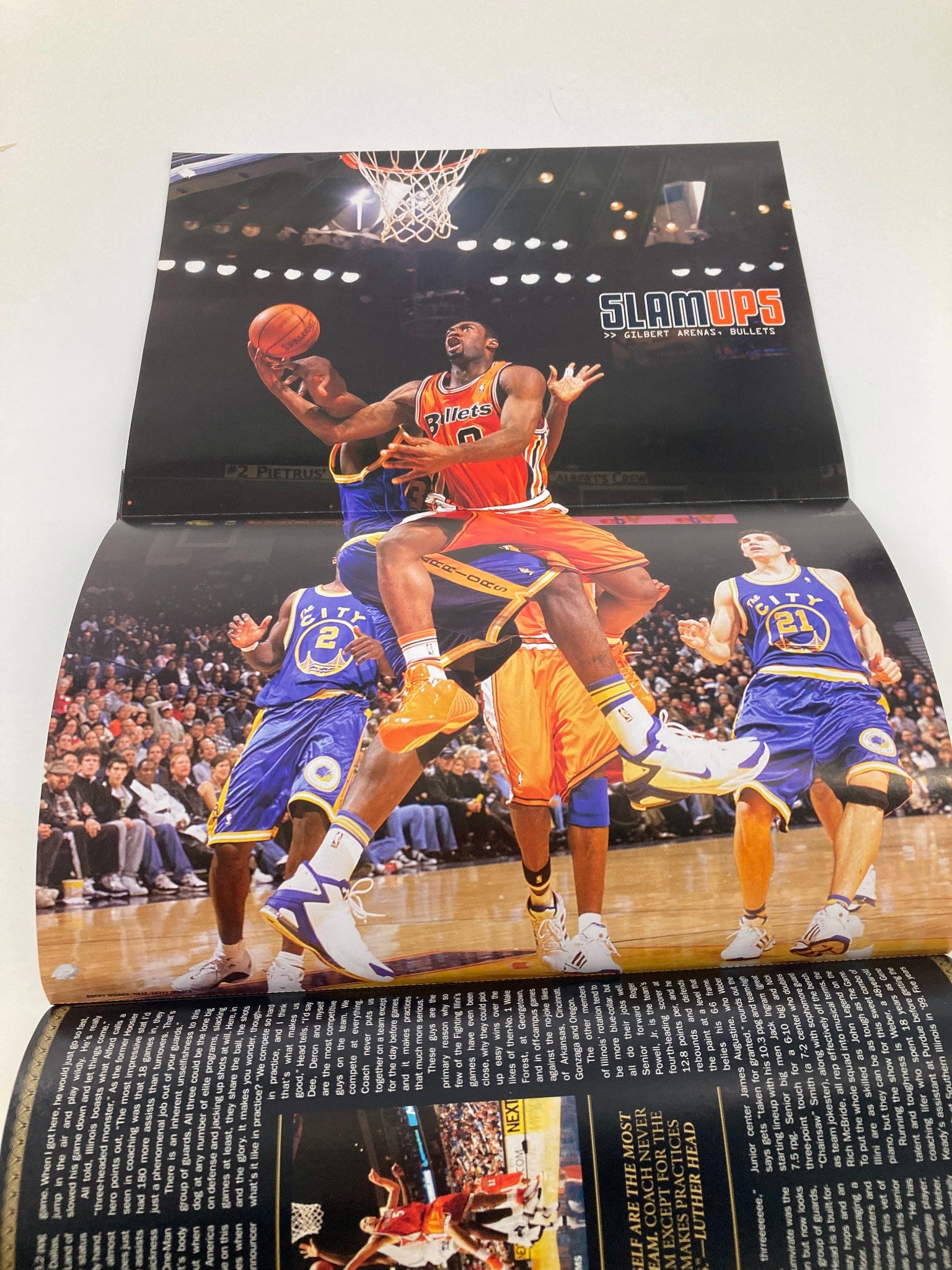Poster spread from Slam Magazine May 2005 depicting intense basketball action with players in motion, featuring dynamic gameplay related to the NBA.