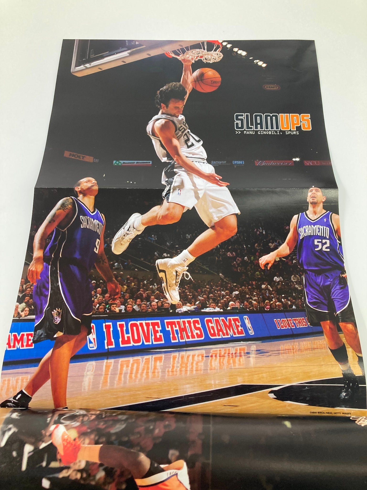 Slam Magazine May 2005 poster depicting an intense basketball moment with a player dunking, part of the collectible issue featuring Miami Heat Dwyane Wade.