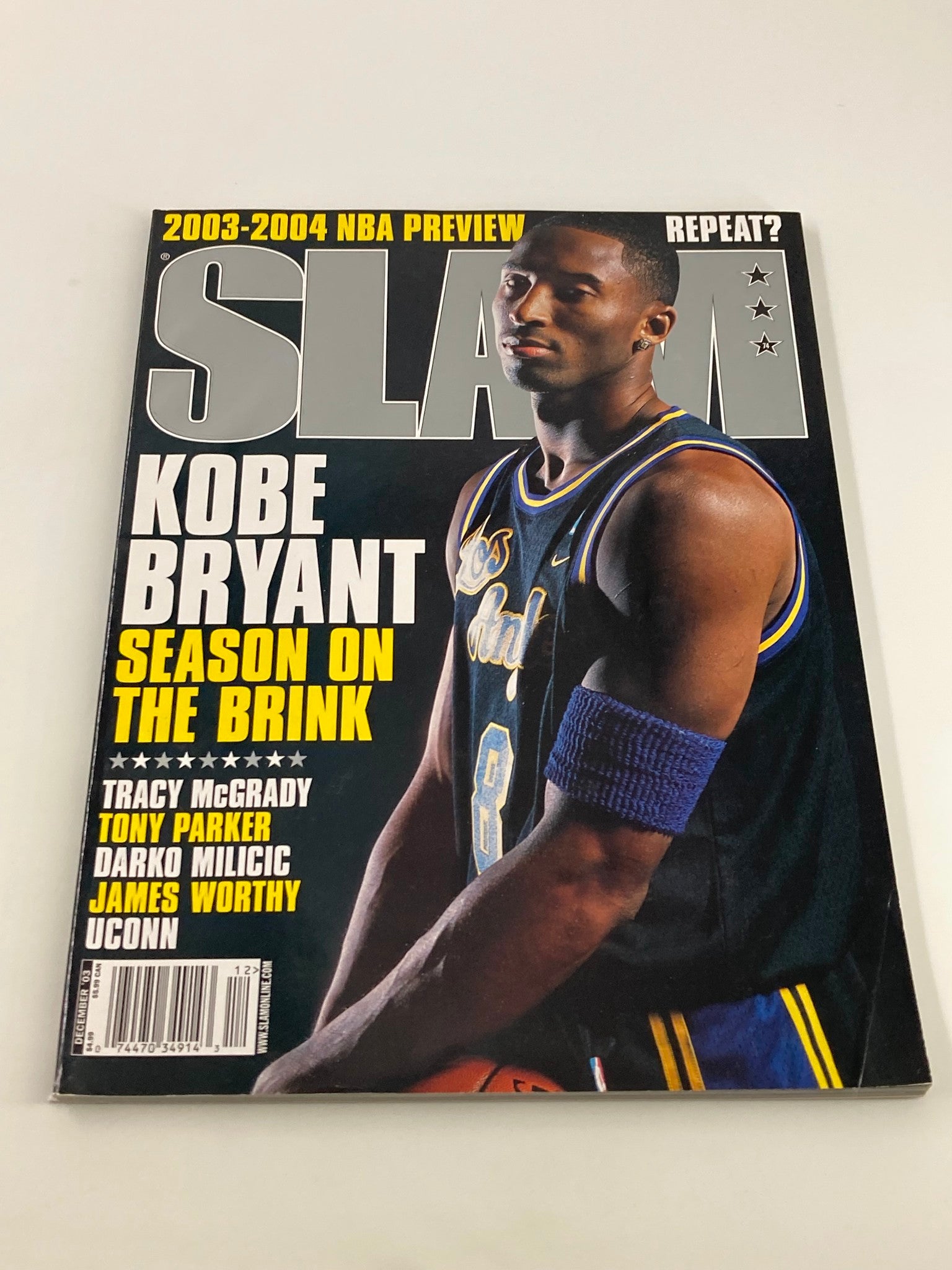 Slam Magazine December 2003 featuring Kobe Bryant on the cover, showcasing the Los Angeles Lakers and including a collectible poster.