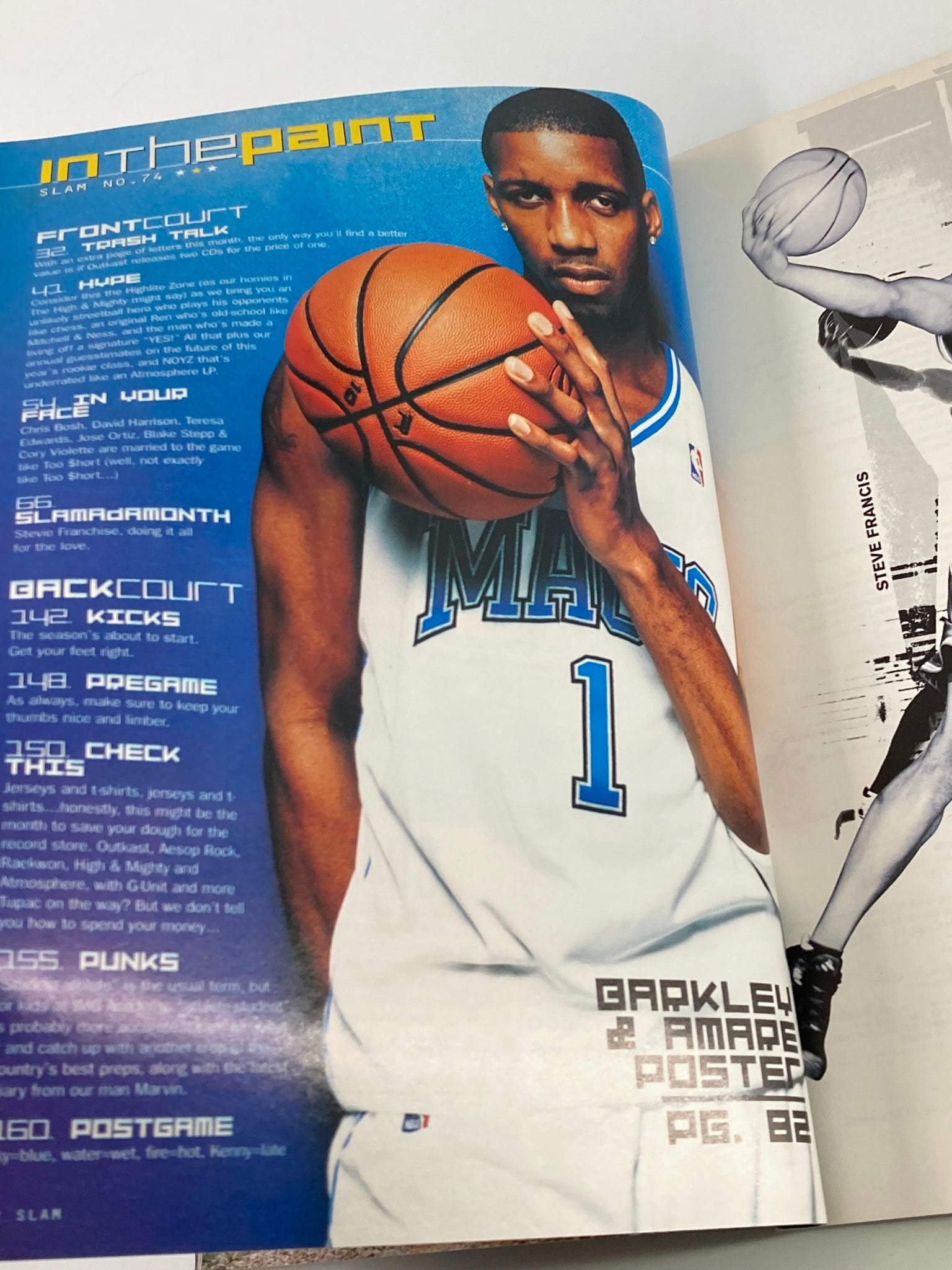 Page from the December 2003 Slam Magazine featuring a player in a Mavericks jersey, illustrating the NBA basketball theme and collectible nature of the magazine.