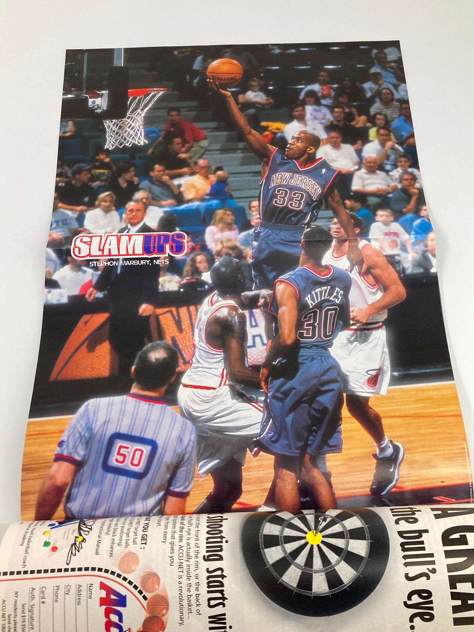 Another poster from Slam Magazine August 1999, showcasing Stephon Marbury performing a jump shot during a game, reflecting the excitement of NBA basketball at the time.