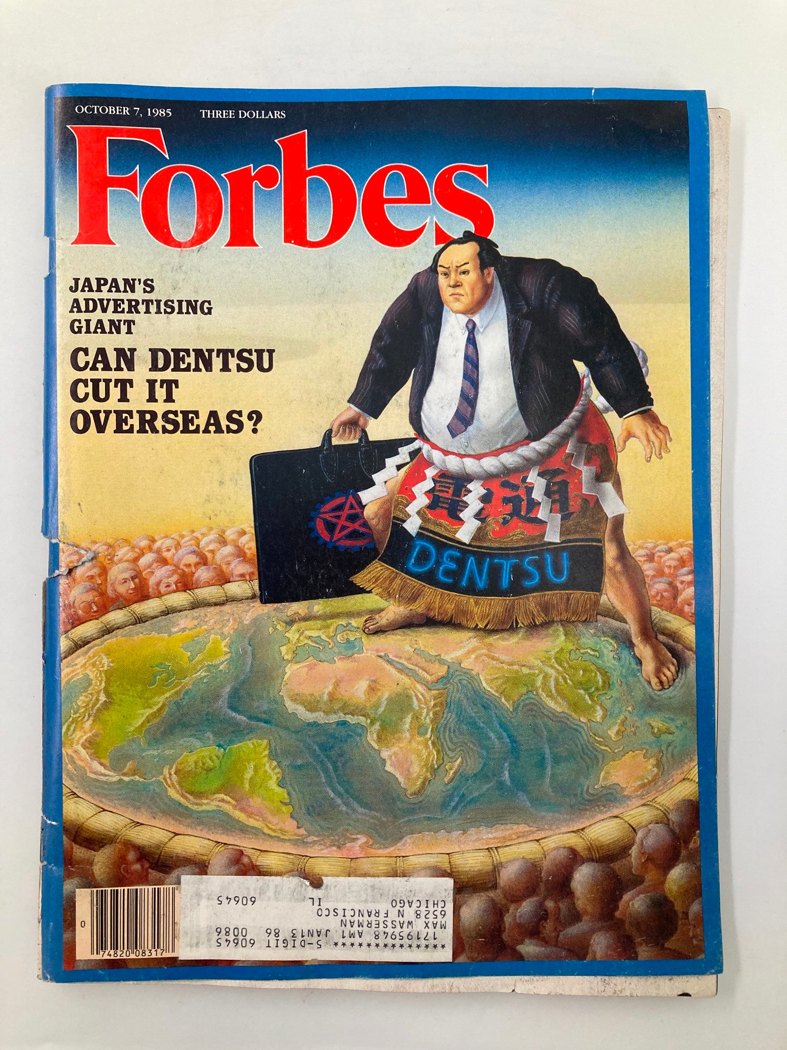 Cover of the vintage Forbes Magazine dated October 7, 1985, featuring the title 'Japan's Ad Giant: Can Dentsu Cut It Overseas?' and an illustration of a businessman in a suit with a suitcase standing on a globe.