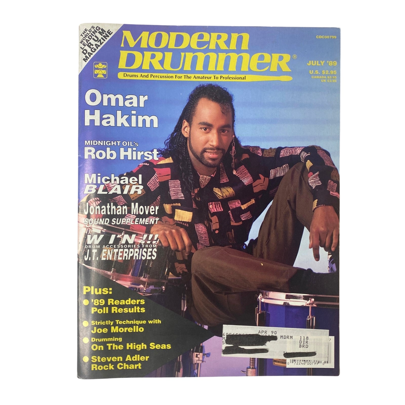 Cover of Modern Drummer Magazine July 1989 featuring Omar Hakim, spotlighting articles on Rob Hirst, Michael Blair, and Jonathan Mover. Ideal for drumming enthusiasts and collectors.