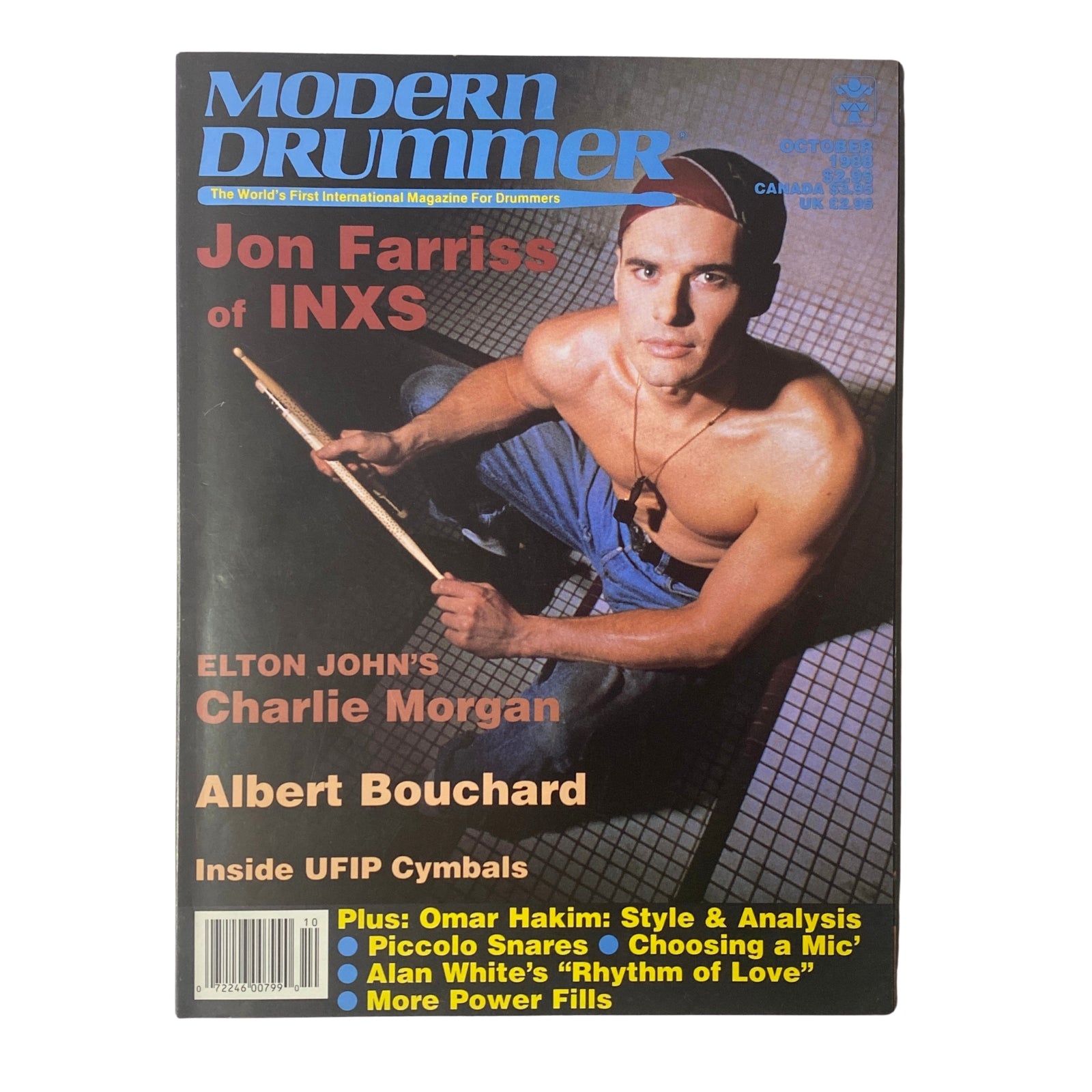Cover of Modern Drummer Magazine October 1988 featuring Jon Farriss of INXS, showcasing articles on Charlie Morgan and Albert Bouchard, along with insights into drumming technology.