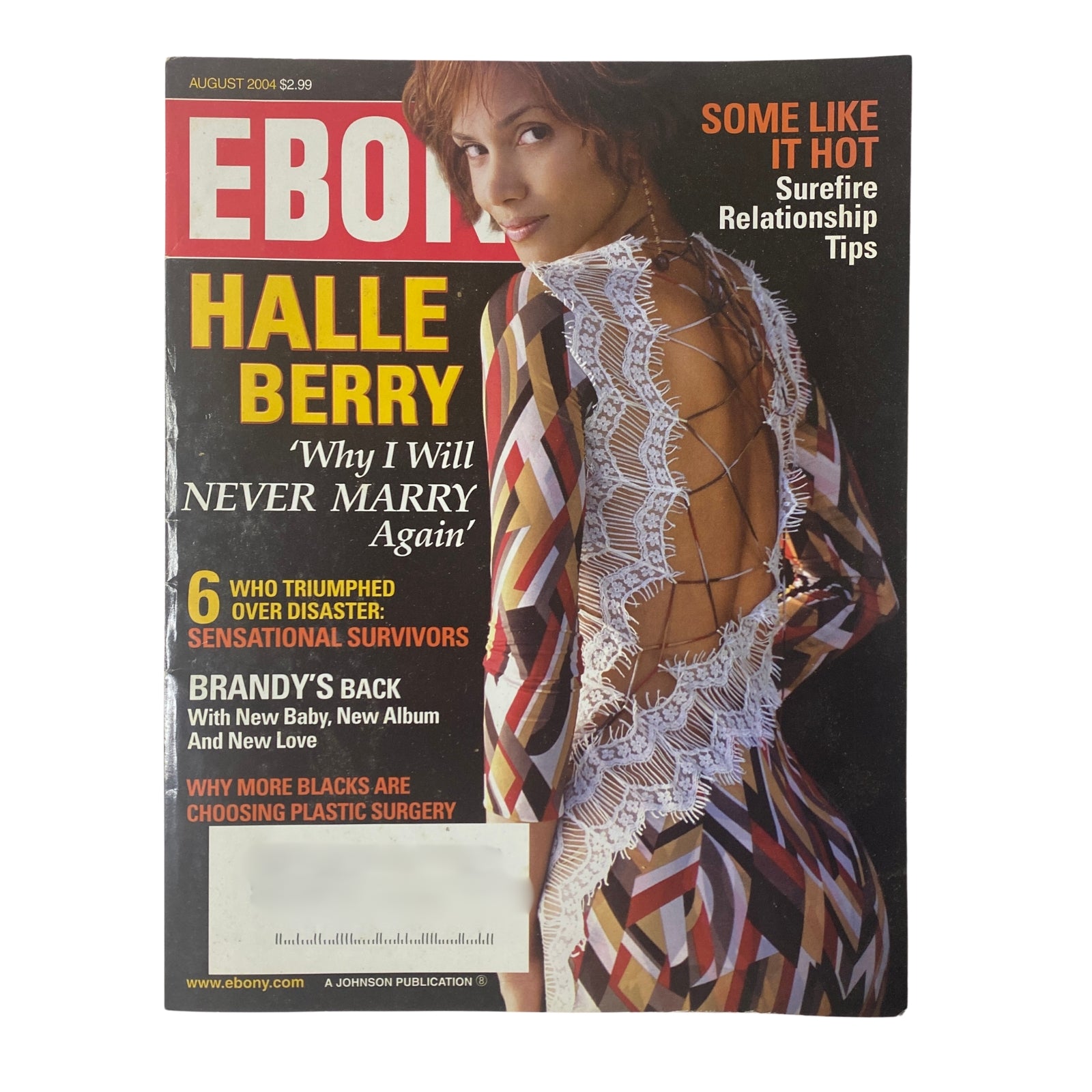 Ebony Magazine August 2004 cover featuring Halle Berry in a striking outfit, highlighting her interview 'Why I Will Never Marry Again' along with features on Brandy and topics like relationship tips.