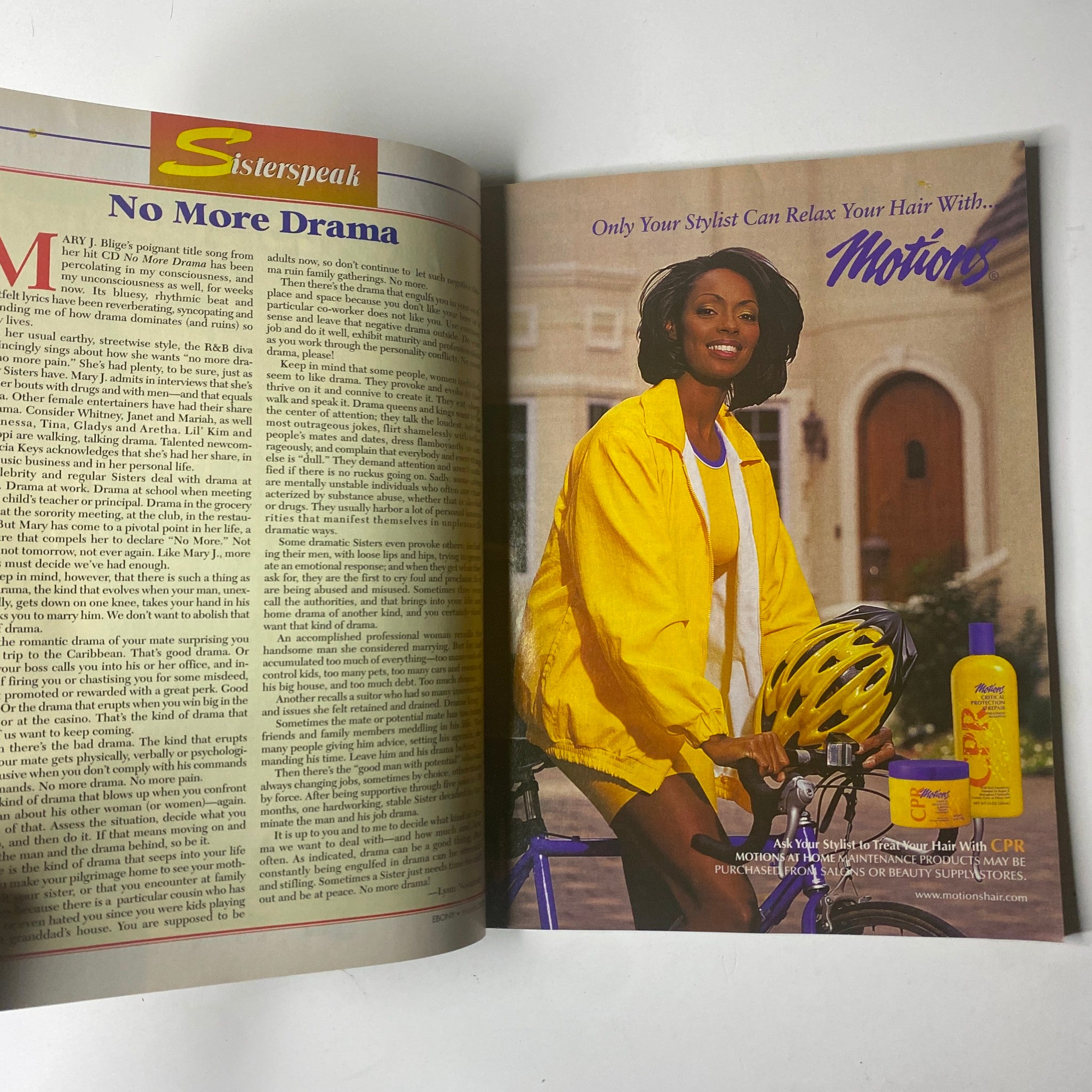 Inside page of Ebony Magazine March 2002 showing an advertisement for Motion hair products with a model in a yellow jacket and bicycle helmet.