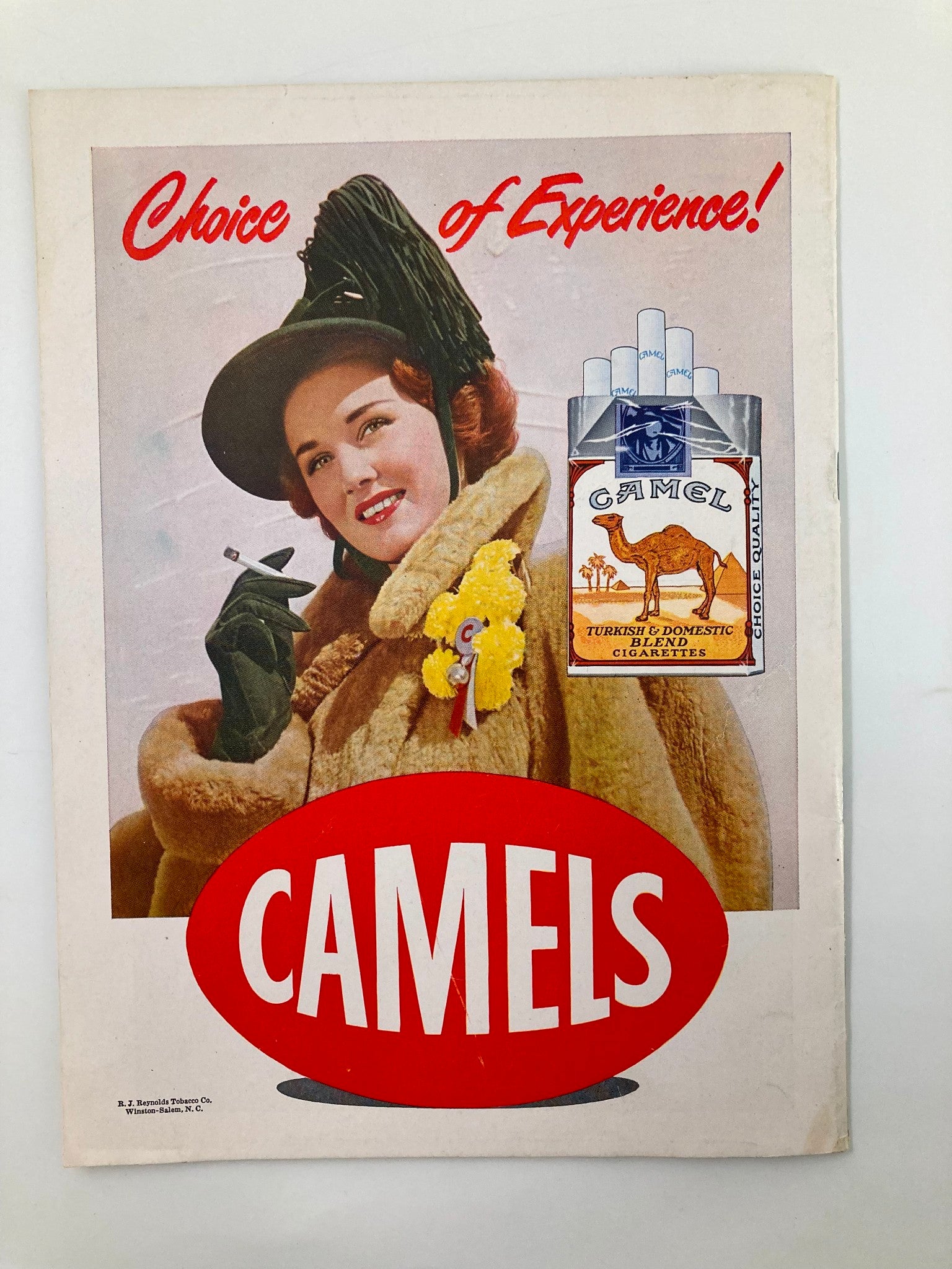 1948 NCAA Football UCLA Bruins vs California Golden Bears The California Gridiron vintage program cover featuring a glamorous woman with fur coat and hat promoting Camels cigarettes.