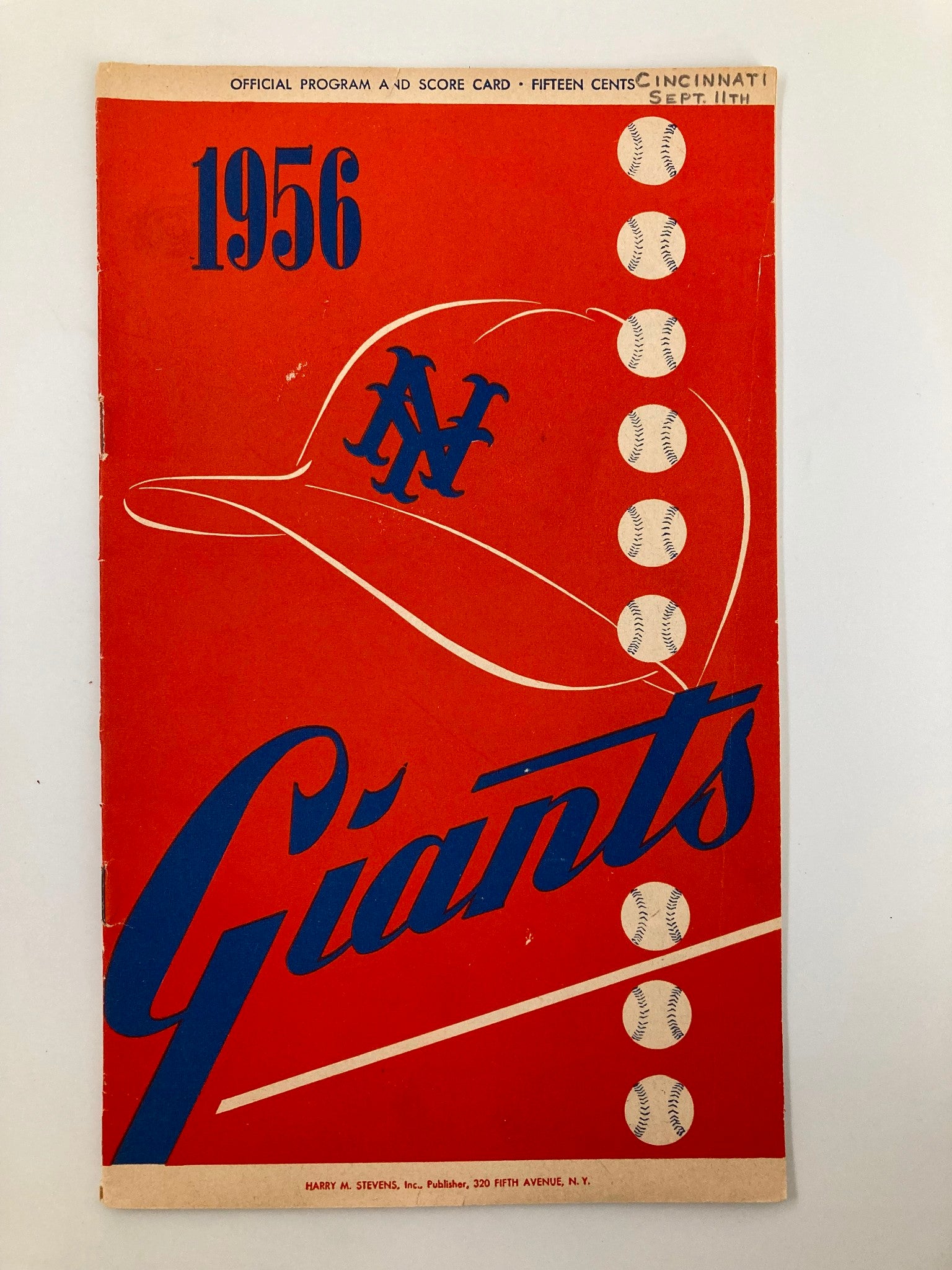 1956 MLB New York Giants Official Program and Score Card cover featuring a baseball cap and bold typography, representing vintage baseball memorabilia.