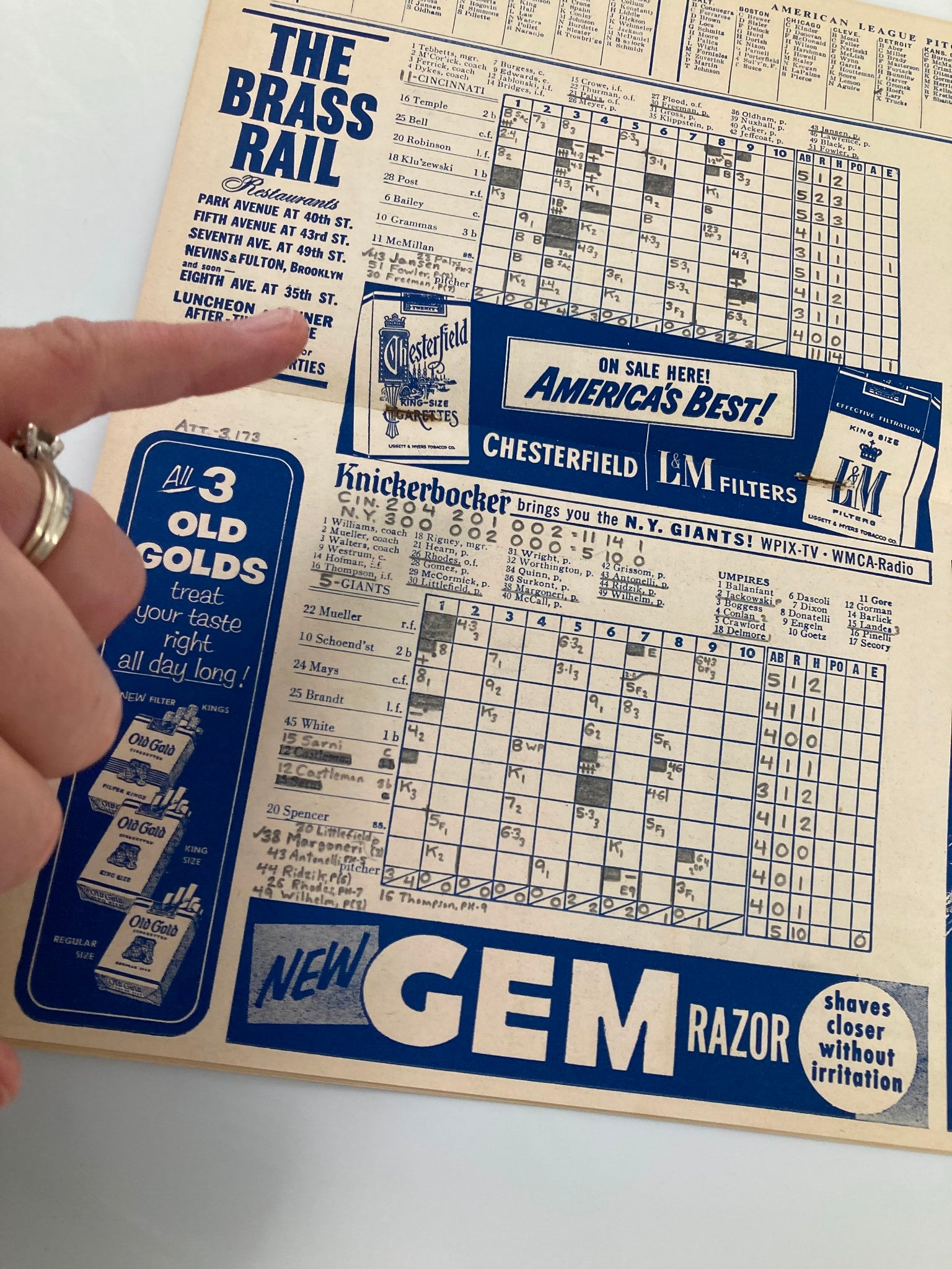 Close-up of the scoreboard from the 1956 MLB New York Giants Official Program and Score Card, detailing game stats and player performances while showcasing a vintage advertisement.