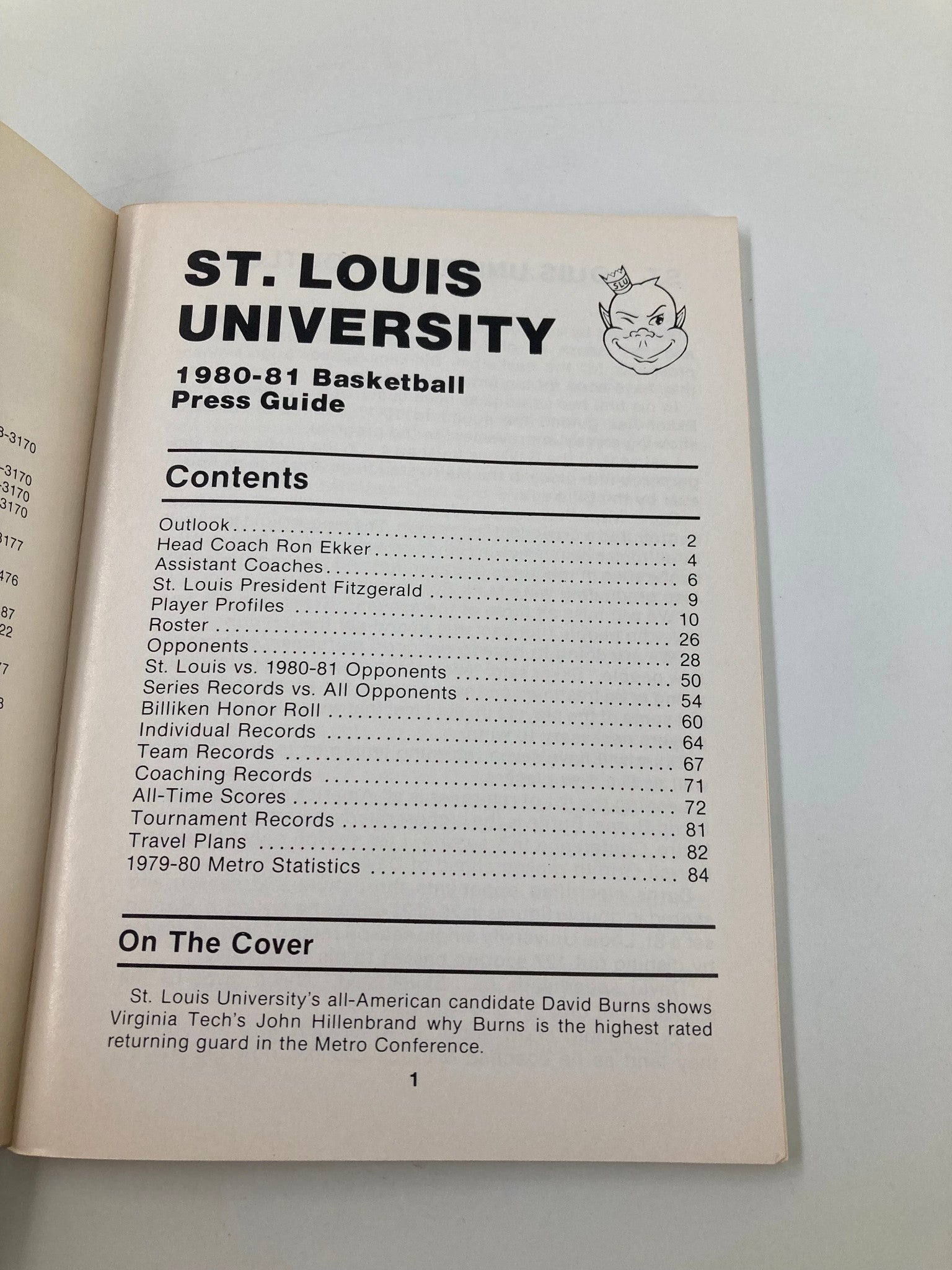 1980-1981 NCAA Saint Louis University Billikens Basketball Press Guide containing contents such as outlook, team records, and player profiles. Features a photo of the press guide's interior highlighting the table of contents.