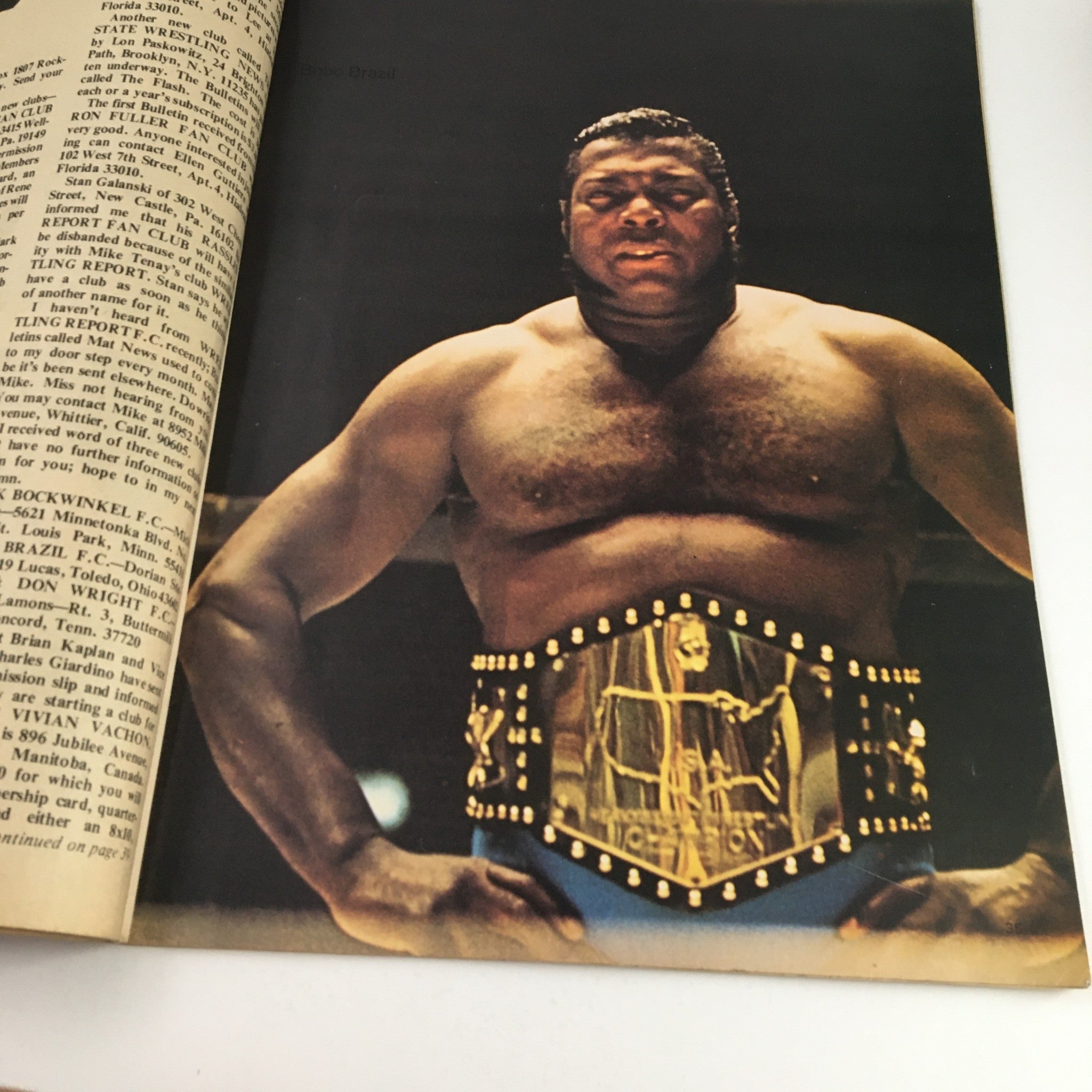 Wrestling World Magazine February 1972 featuring a powerful photograph of a champion wrestler posing with a title belt, representing the glory of wrestling.