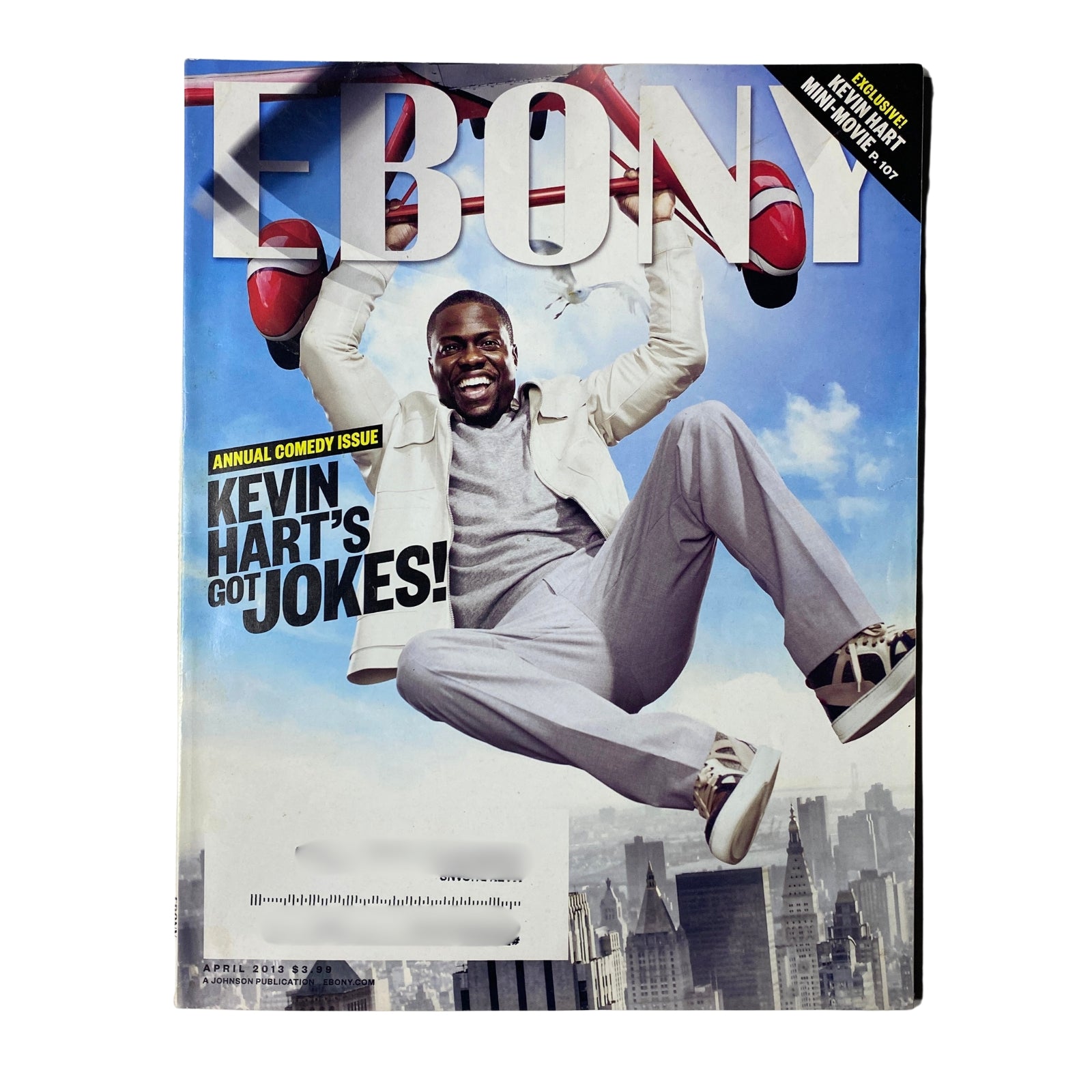 Ebony Magazine April 2013 Vol. LXVIII, No. 6 featuring Kevin Hart on the cover, showcasing the theme of comedy with Hart depicted in a playful pose against a city skyline.