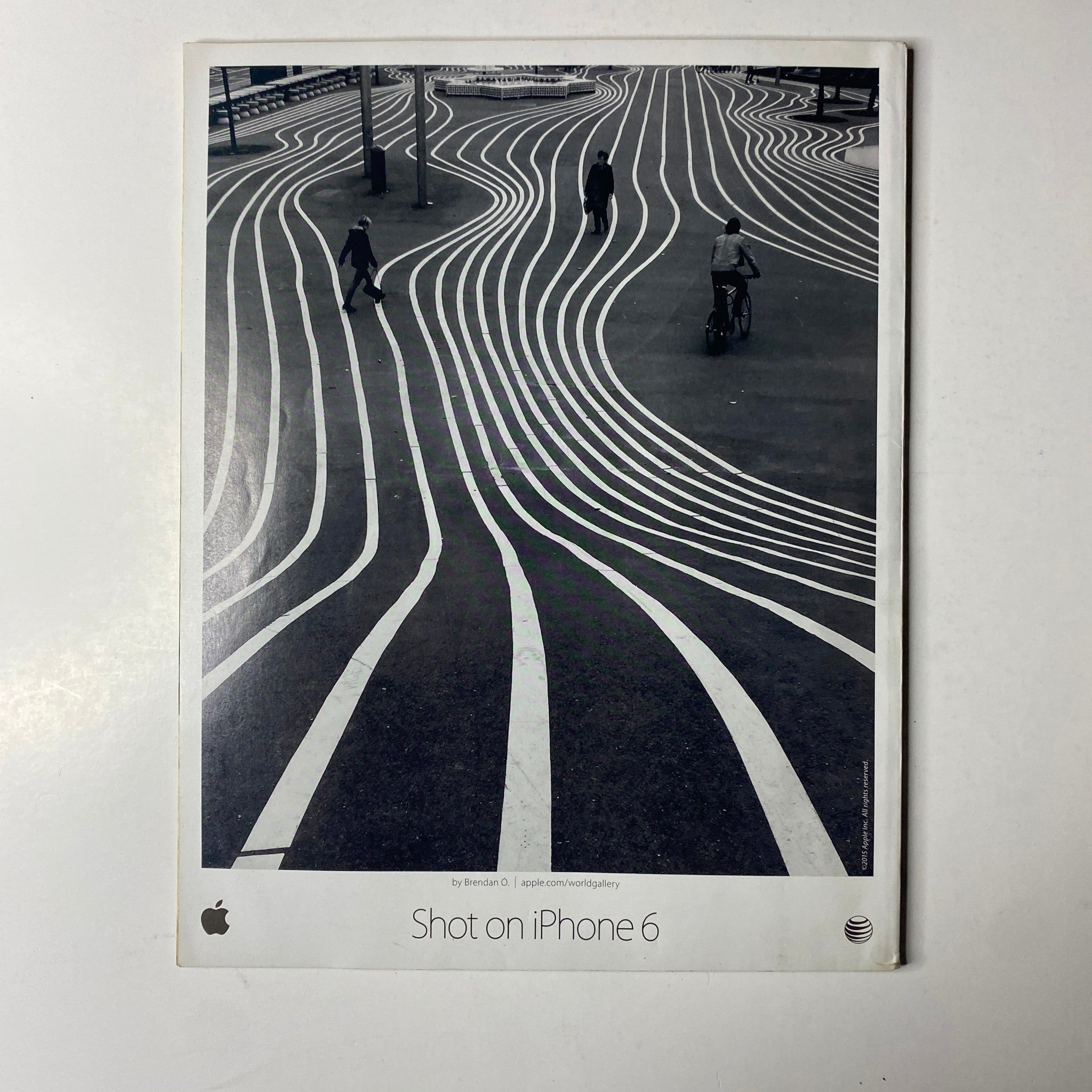 Advertisement for iPhone 6 with artistic street photography, featured in Ebony Magazine June 2015 Vol. LXX, No. 8.