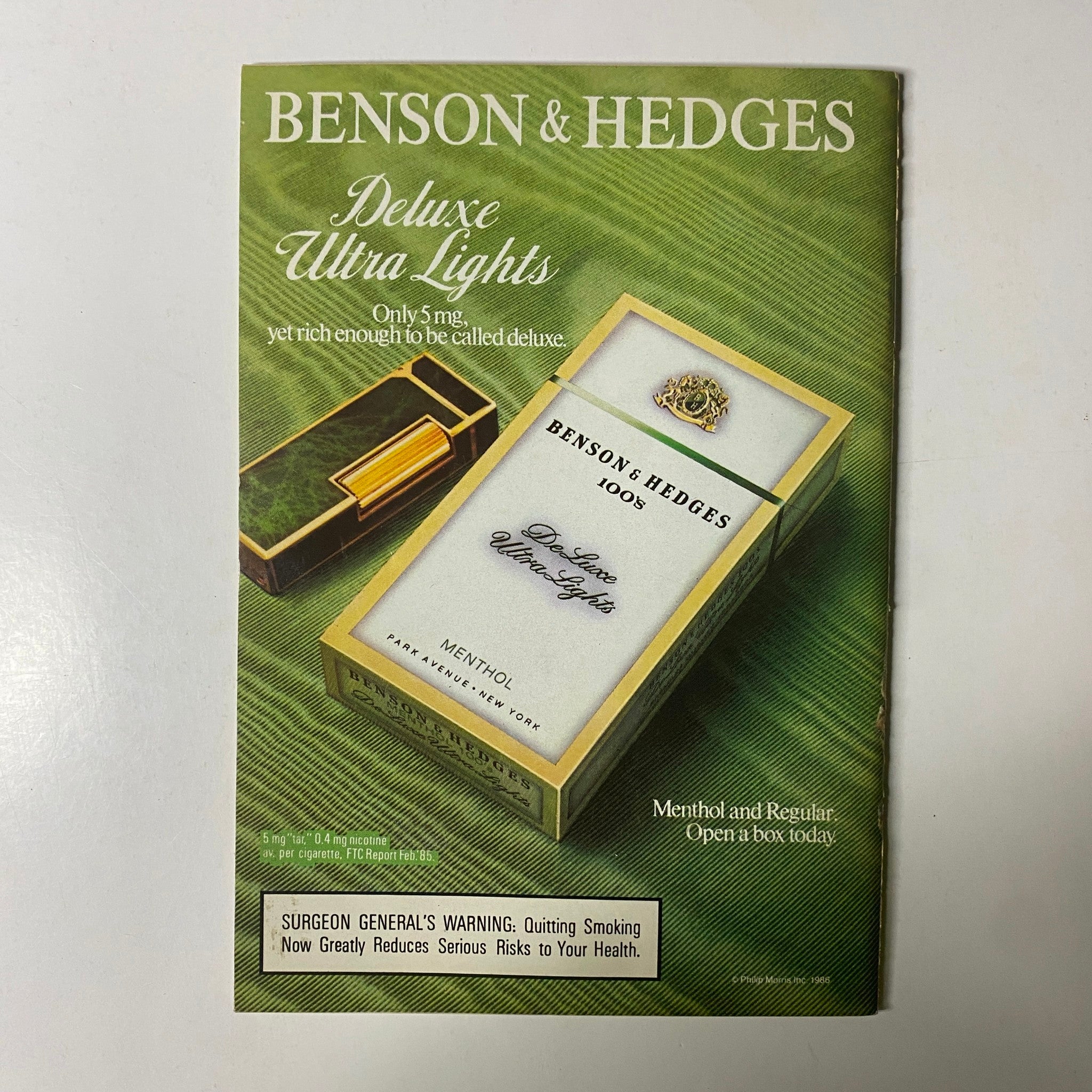 Vintage advertisement for Benson & Hedges cigarettes in Jet Magazine, December 22, 1986, featuring a stylish pack design emphasizing 'Deluxe Ultra Lights,' Volume 71, No. 14.