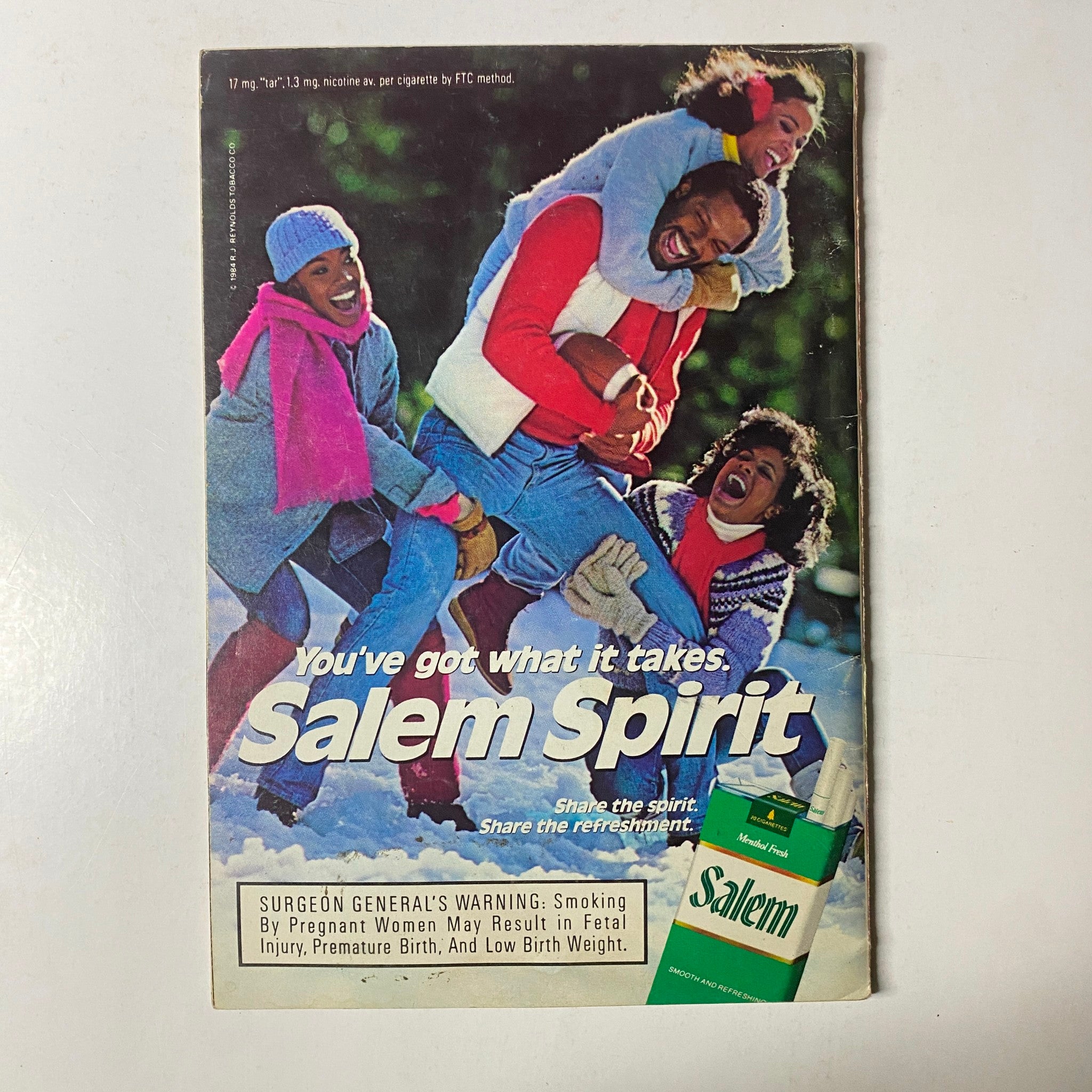 Promotional advertisement for Salem cigarettes on the back cover of Jet Magazine February 16, 1987, featuring a group of friends enjoying winter activities.