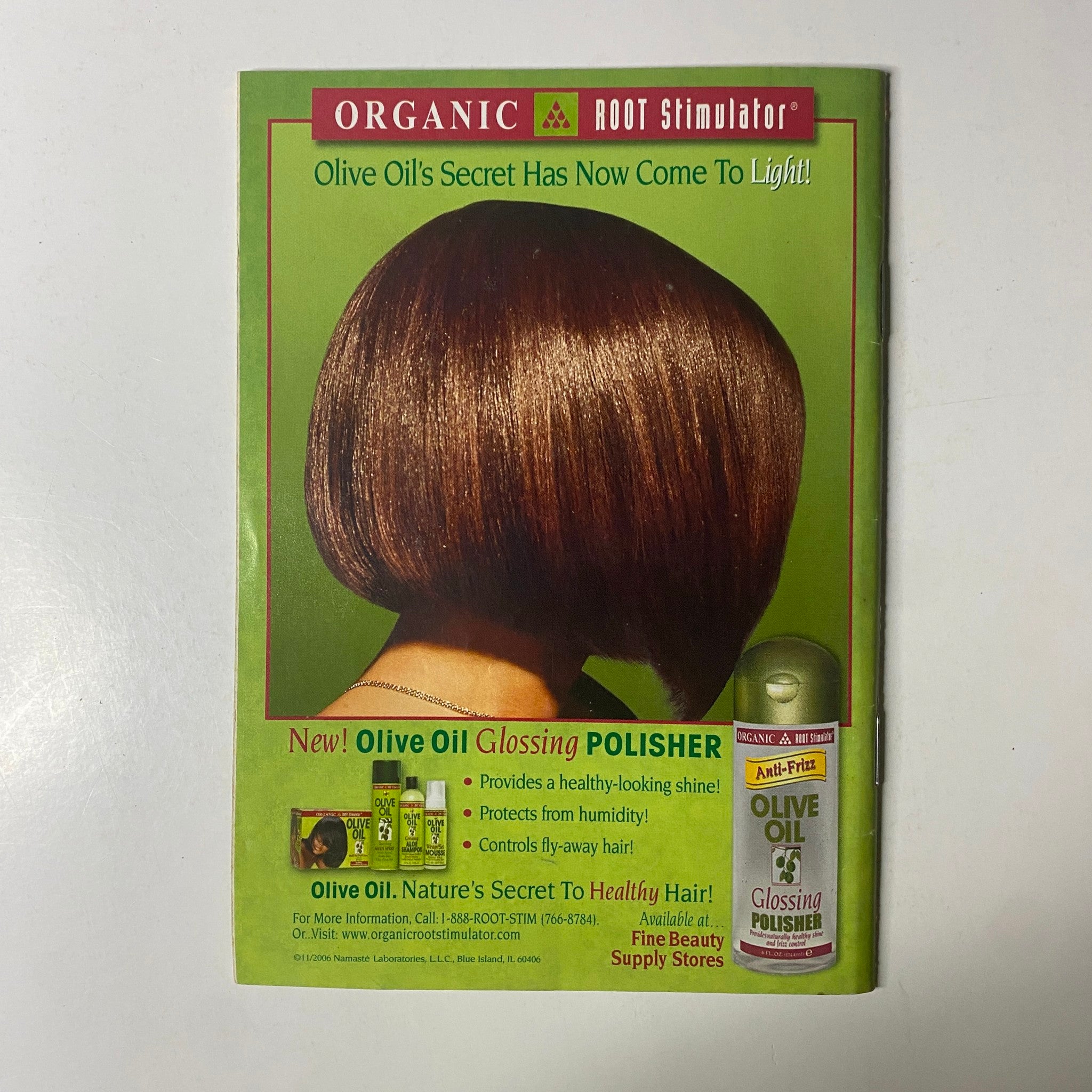 Advertisement for Organic Root Stimulator in Jet Magazine, November 20, 2006, Vol. 110, No. 20. The ad promotes Olive Oil Glossing Polisher for healthy hair.