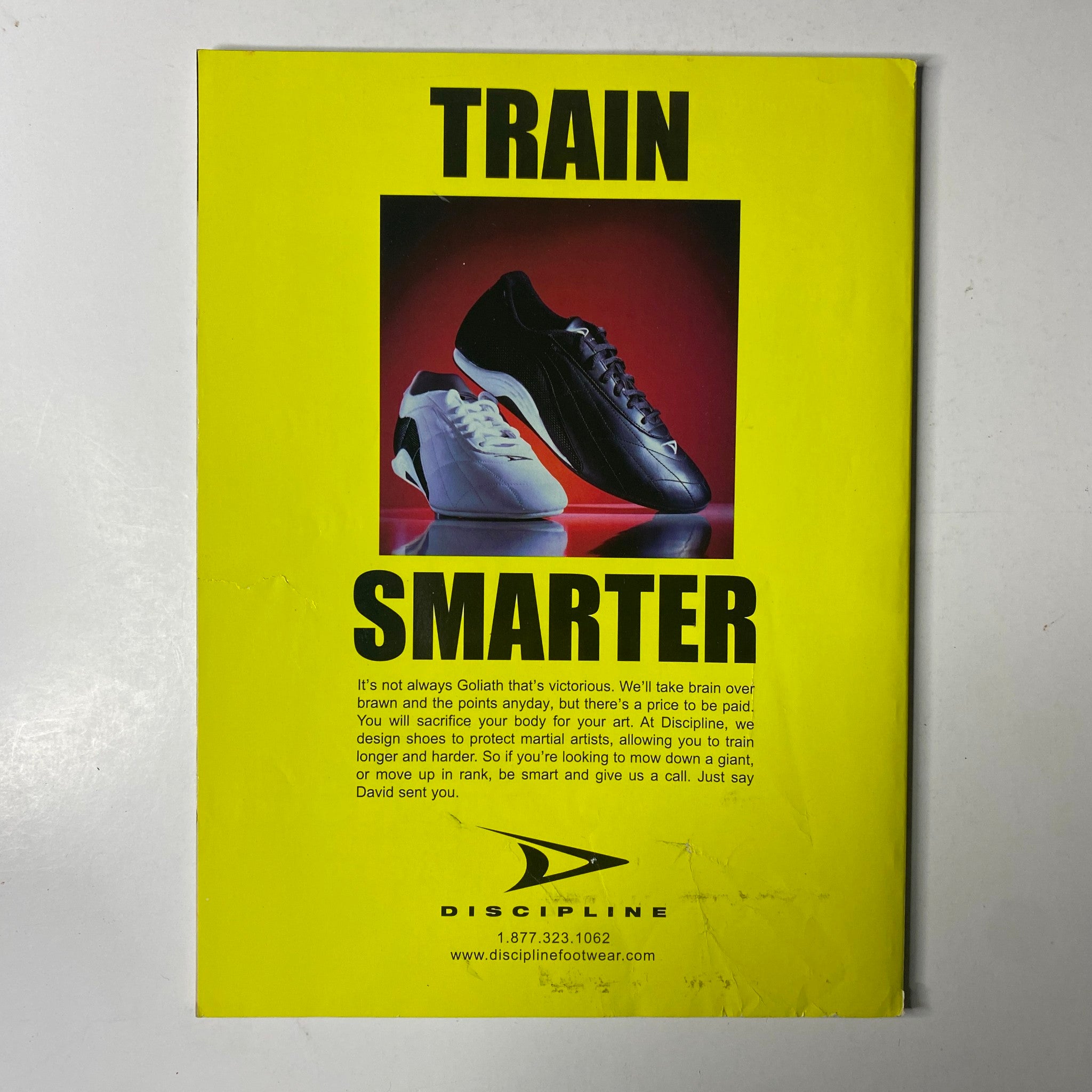 Advertisement for Discipline footwear, promoting training shoes for martial artists, featured in Inside Kung Fu Magazine February 2003.