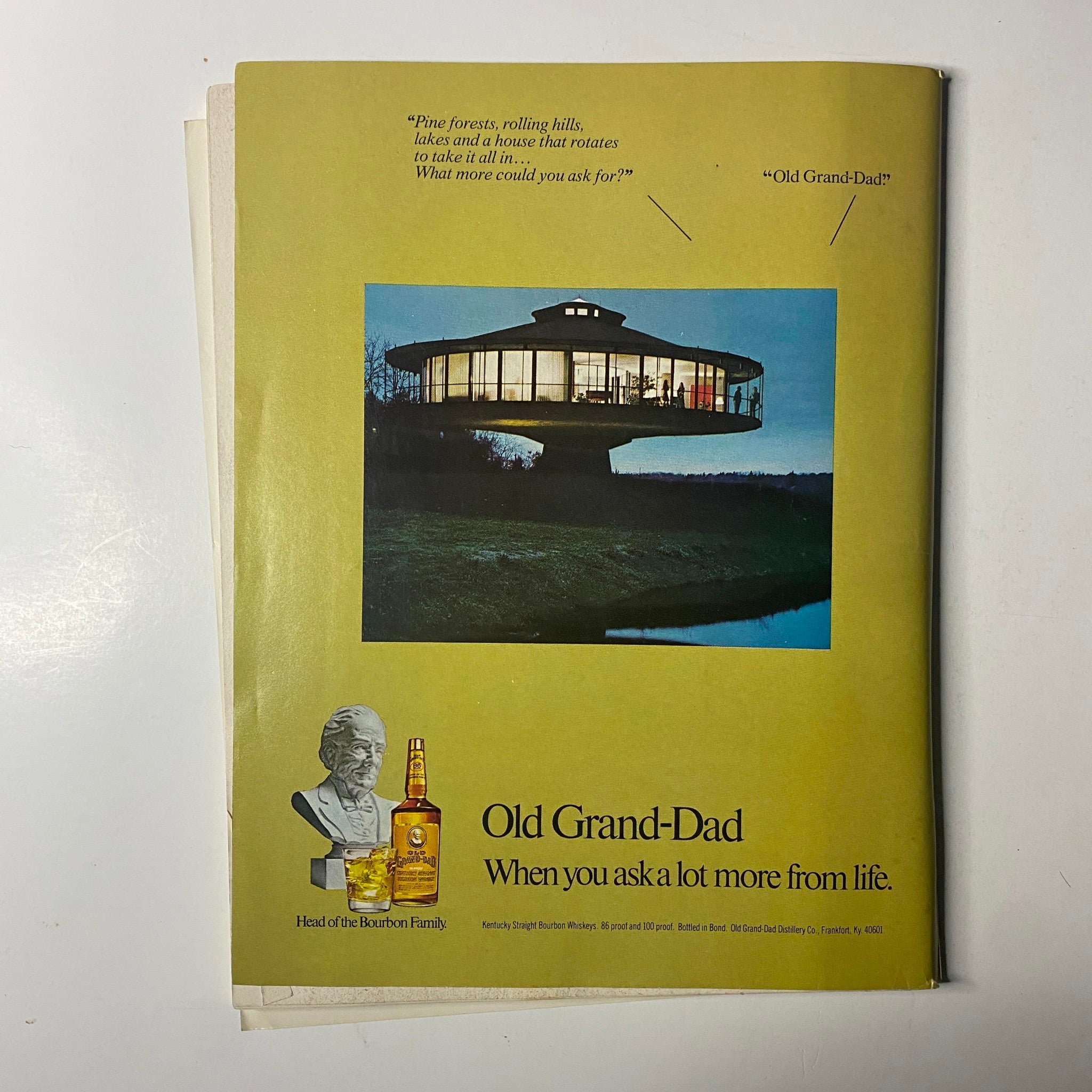 Advertisement page from Chicago Magazine January 1977 featuring Old Grand-Dad bourbon with an artistic image of a futuristic house, emphasizing luxurious living.