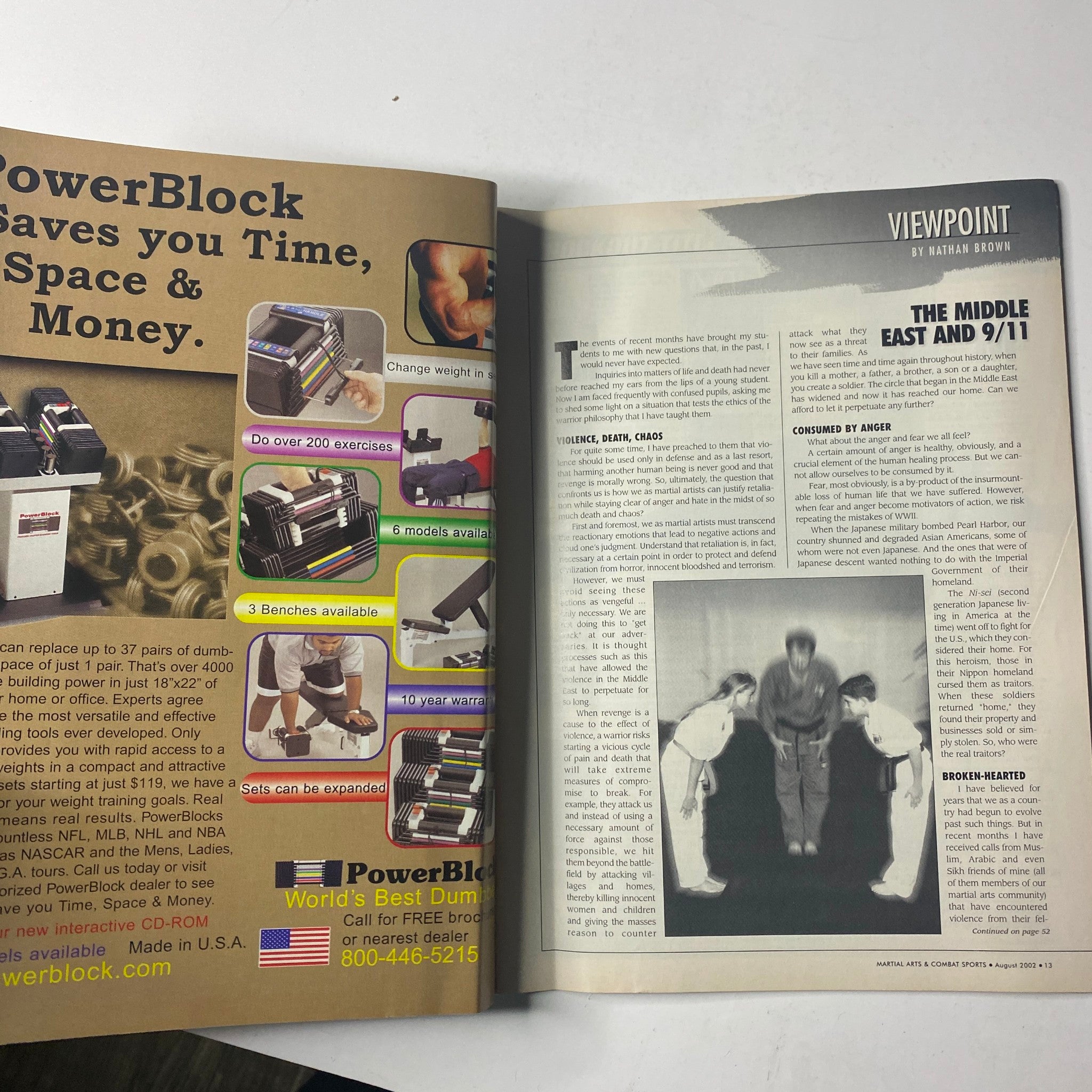 Inside view of Martial Arts Combat Sports Magazine August 2002 featuring a Page on PowerBlock exercise equipment and a Viewpoint article by Nathan Brown discussing the Middle East and 9/11.
