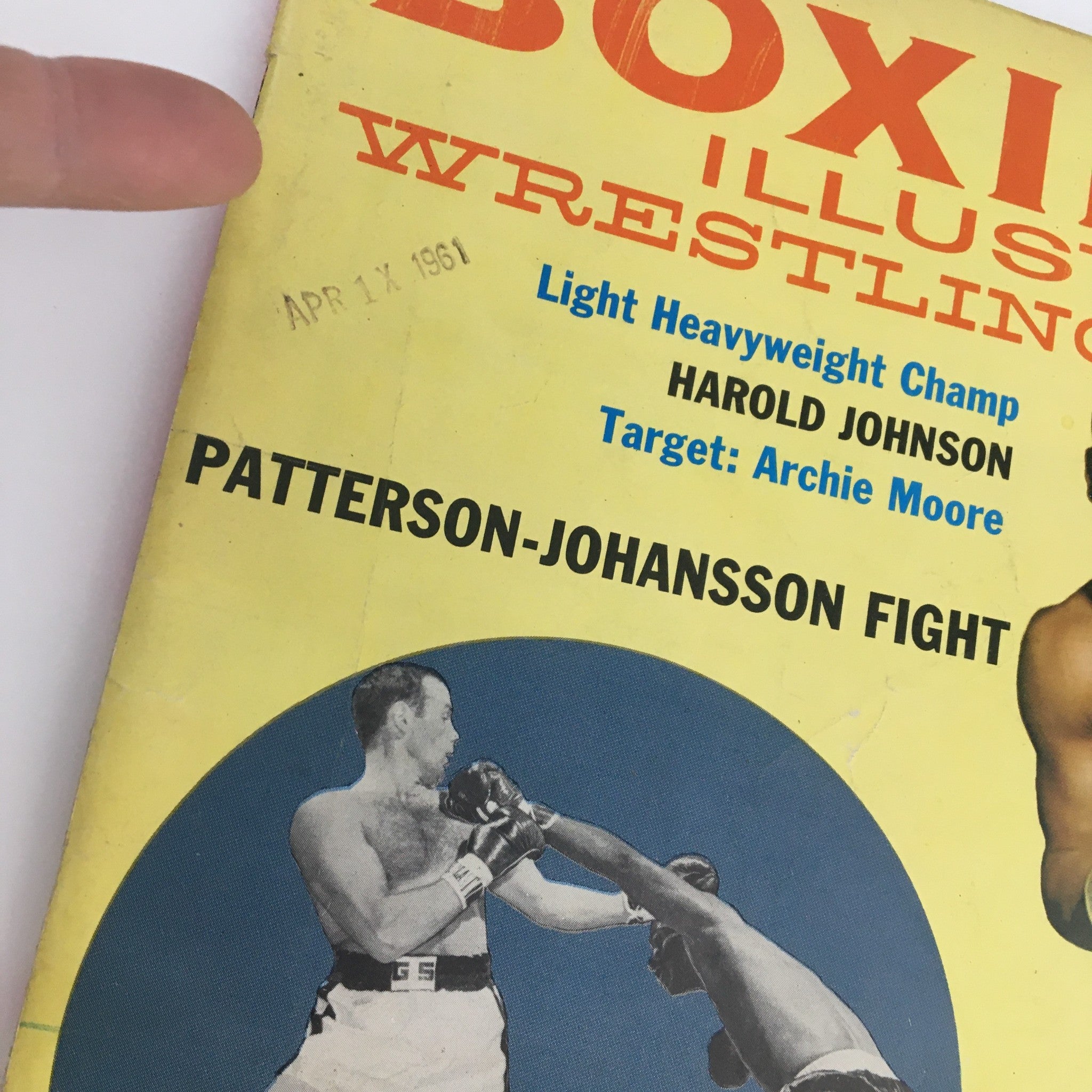 Cover of Boxing Illustrated May 1961 featuring the Patterson-Johansson fight and additional context on Harold Johnson and Archie Moore.