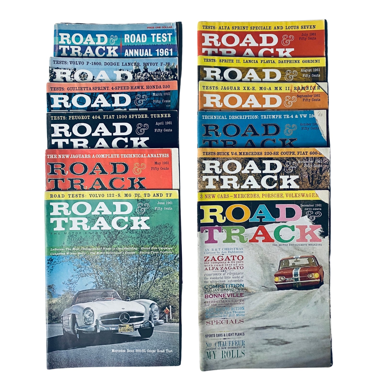 Collection of 12 Road & Track Magazines from 1961 February to December along with the Road Test Annual set, showcasing various vintage automobiles and automotive reviews.