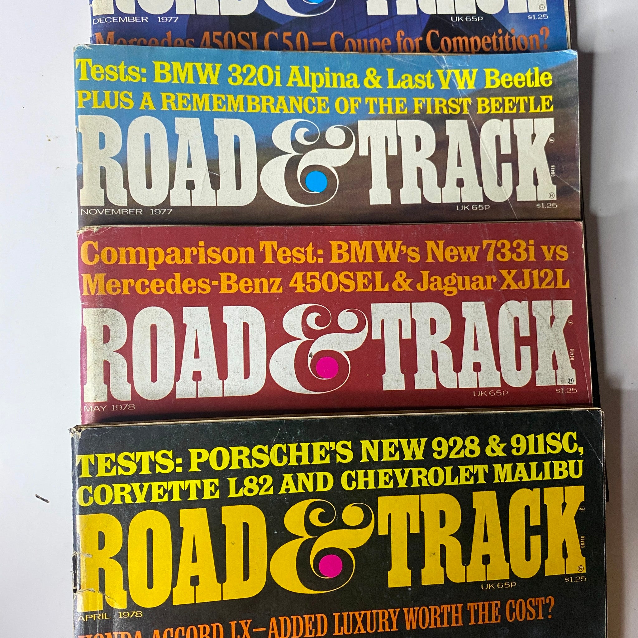 Lot of 24 Road & Track Magazine 1976 - 1979, displaying November 1977 and April 1978 issues, covering automotive tests and comparisons.
