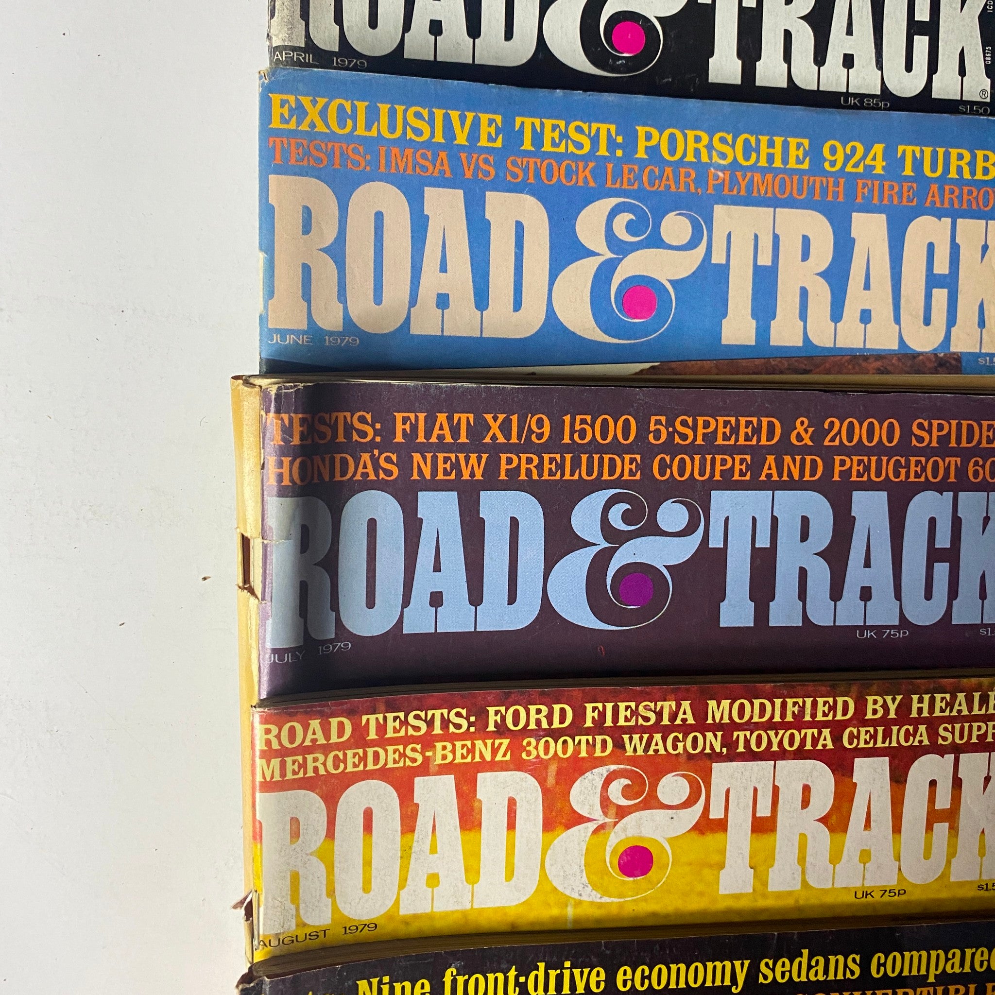 Lot of 24 Road & Track Magazine 1976 - 1979, revealing June 1979 issue alongside other editions, focusing on vehicle performance and reviews.