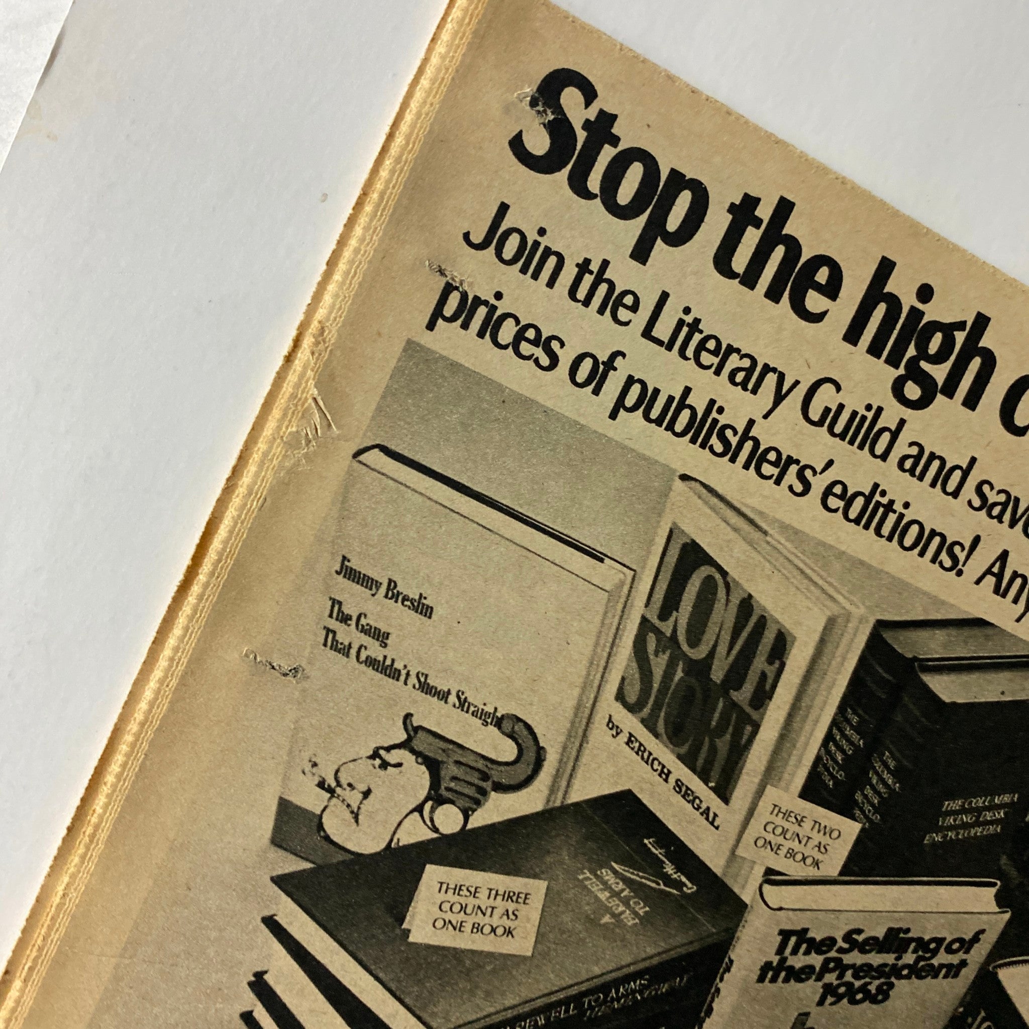 Close-up of a vintage advertisement from The New York Times Book Review 1970, showcasing popular book titles and offering a special deal from the Literary Guild.