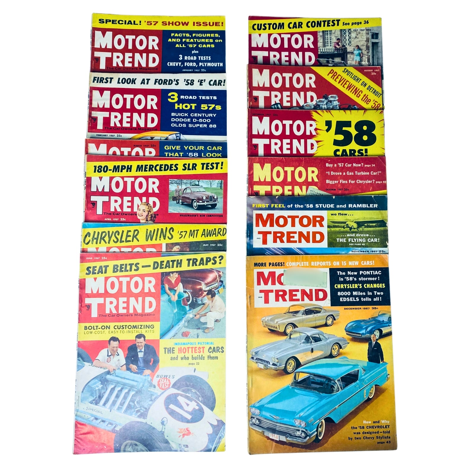 Lot of 12 Motor Trend Magazine issues from 1957, showcasing vintage automotive culture including cars, road tests, and advertisements from January to December.