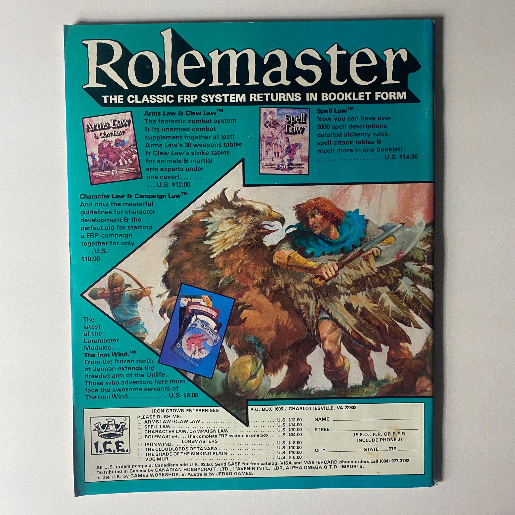 Back cover of Rolemaster booklet, featuring advertisements for gaming supplements such as Arms Law and Spell Law, showcasing vibrant fantasy artwork and details about character development for tabletop role-playing games. Part of the VTG Dragon Magazine January 1985 issue, #93.