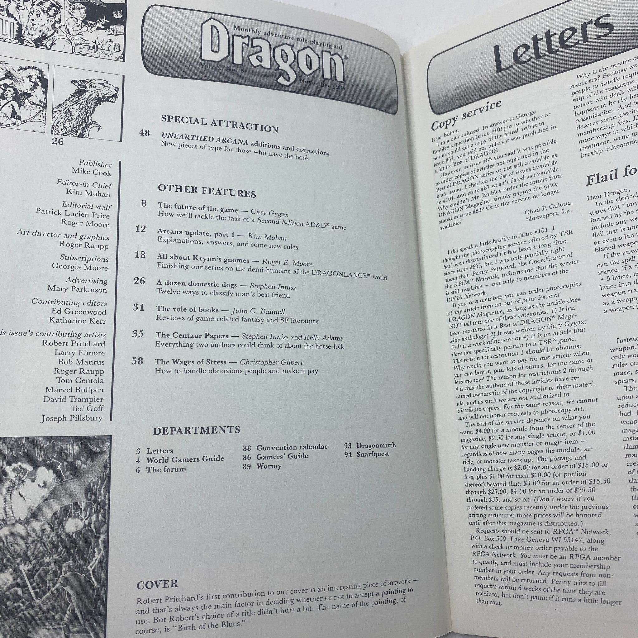 Inside pages of Dragon Magazine November 1985 Issue #103 showing contents and articles including 'Unearthed Arcana' and various game features.
