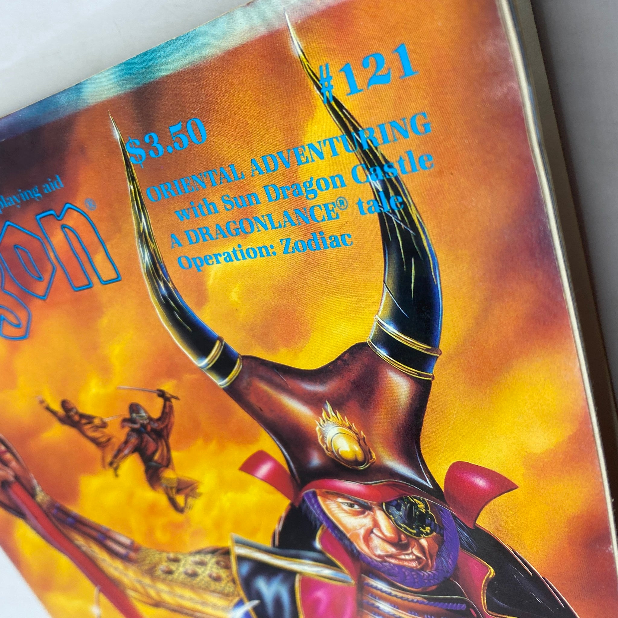 Close-up of the cover of Dragon Magazine May 1987 #121, showcasing the title and subtitle about Oriental Adventuring.