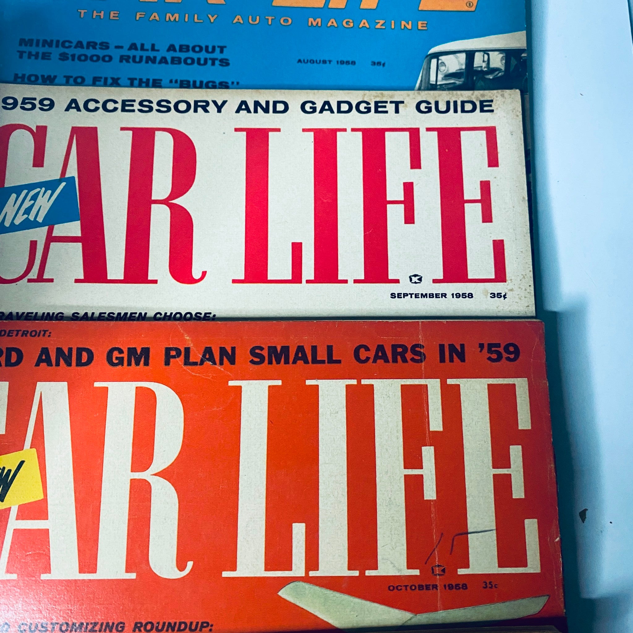 Lot of 10 Car Life The Family Auto Magazine from 1958, highlighting June, September, and October covers, featuring articles on imported cars and automotive tips for families.