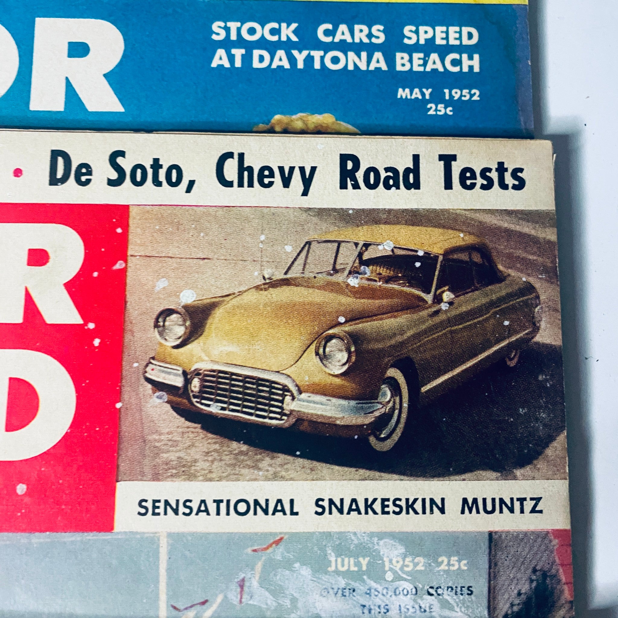 Lot of 7 Motor Trend Magazine, featuring the May 1952 cover highlighting a De Soto car and Chevy road tests, showcasing period automotive trends.