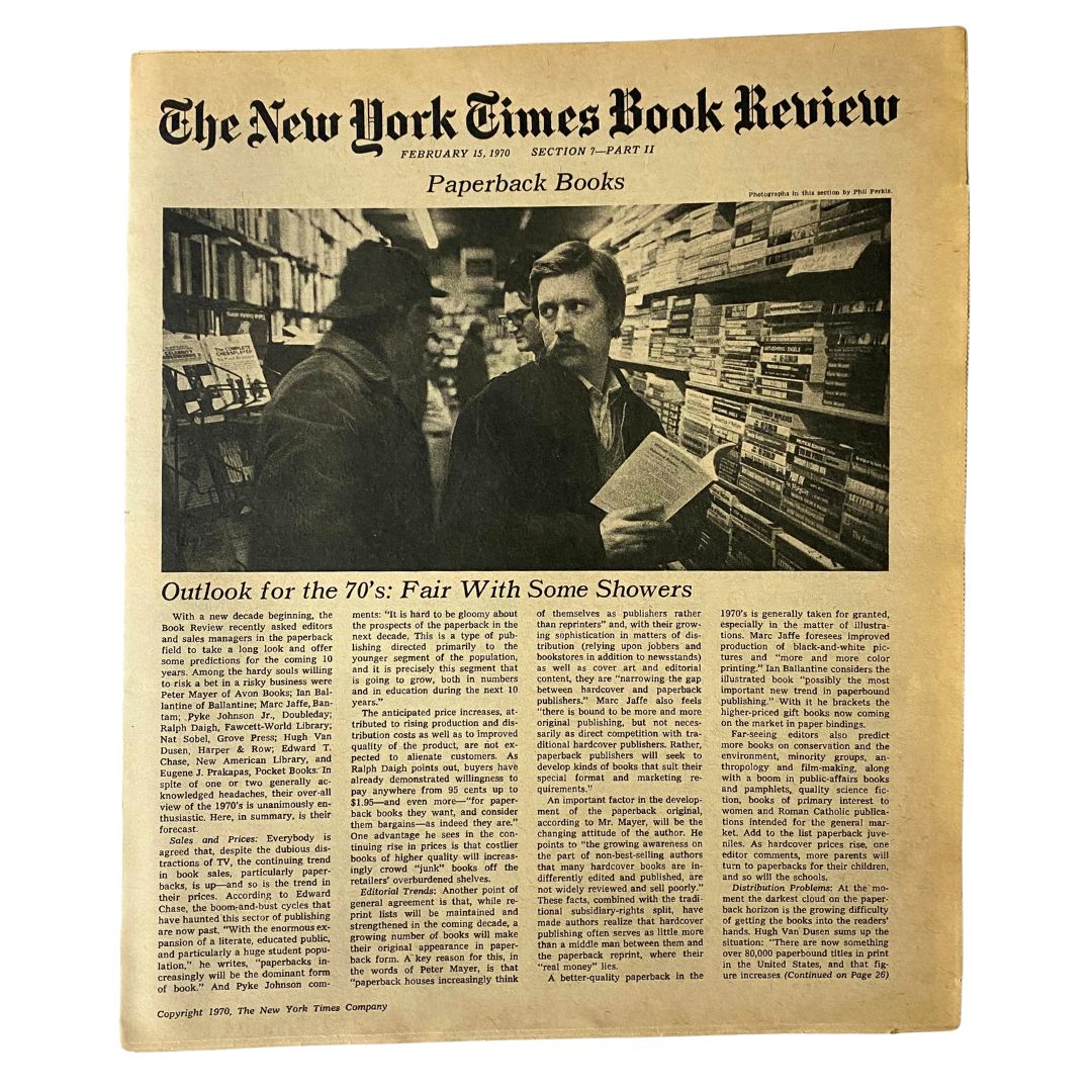 The New York Times Book Review February 15 1970, featuring an article titled 'Outlook for the 70's: Fair With Some Showers', includes a photograph of two men browsing bookshelves.