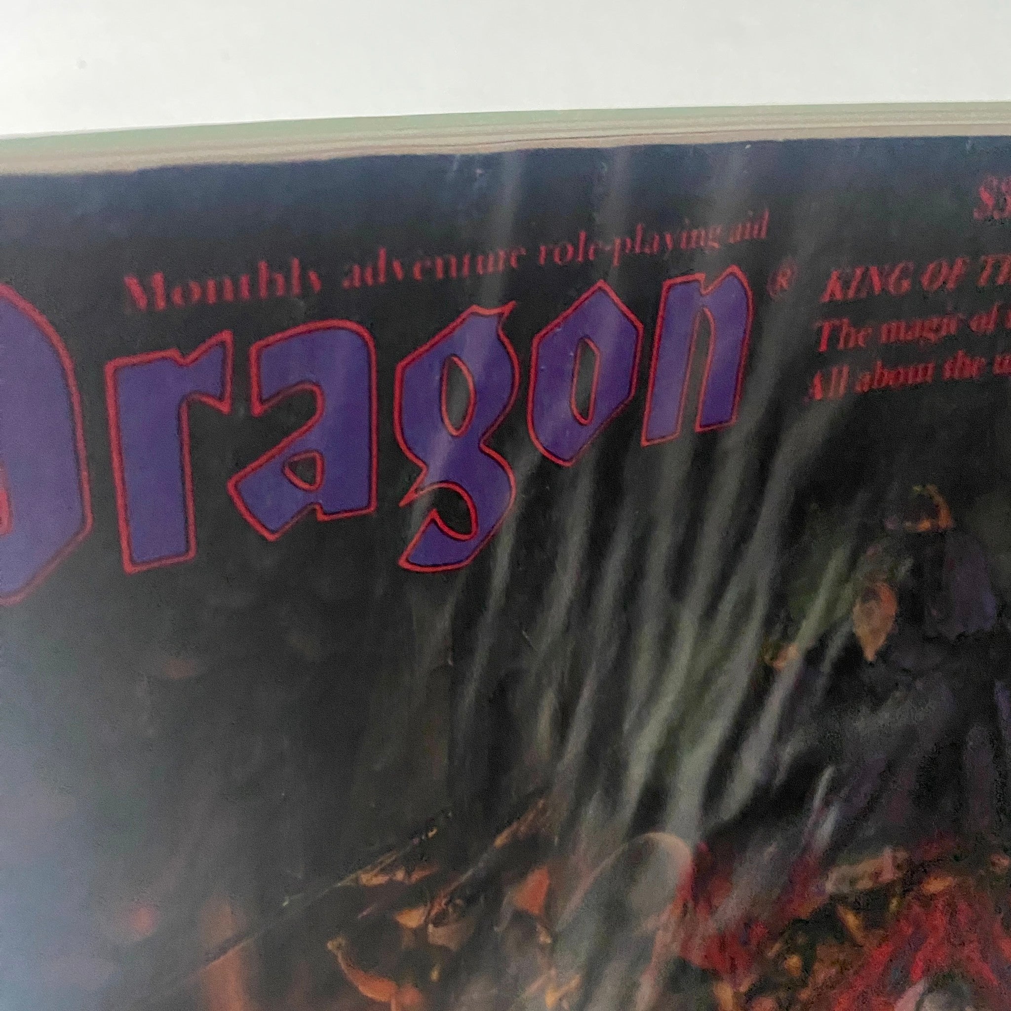 Cover image of VTG Dragon Magazine September 1983 #77 titled 'King of the Tabletop' featuring the word 'Dragon' prominently displayed with a fantasy artwork backdrop.