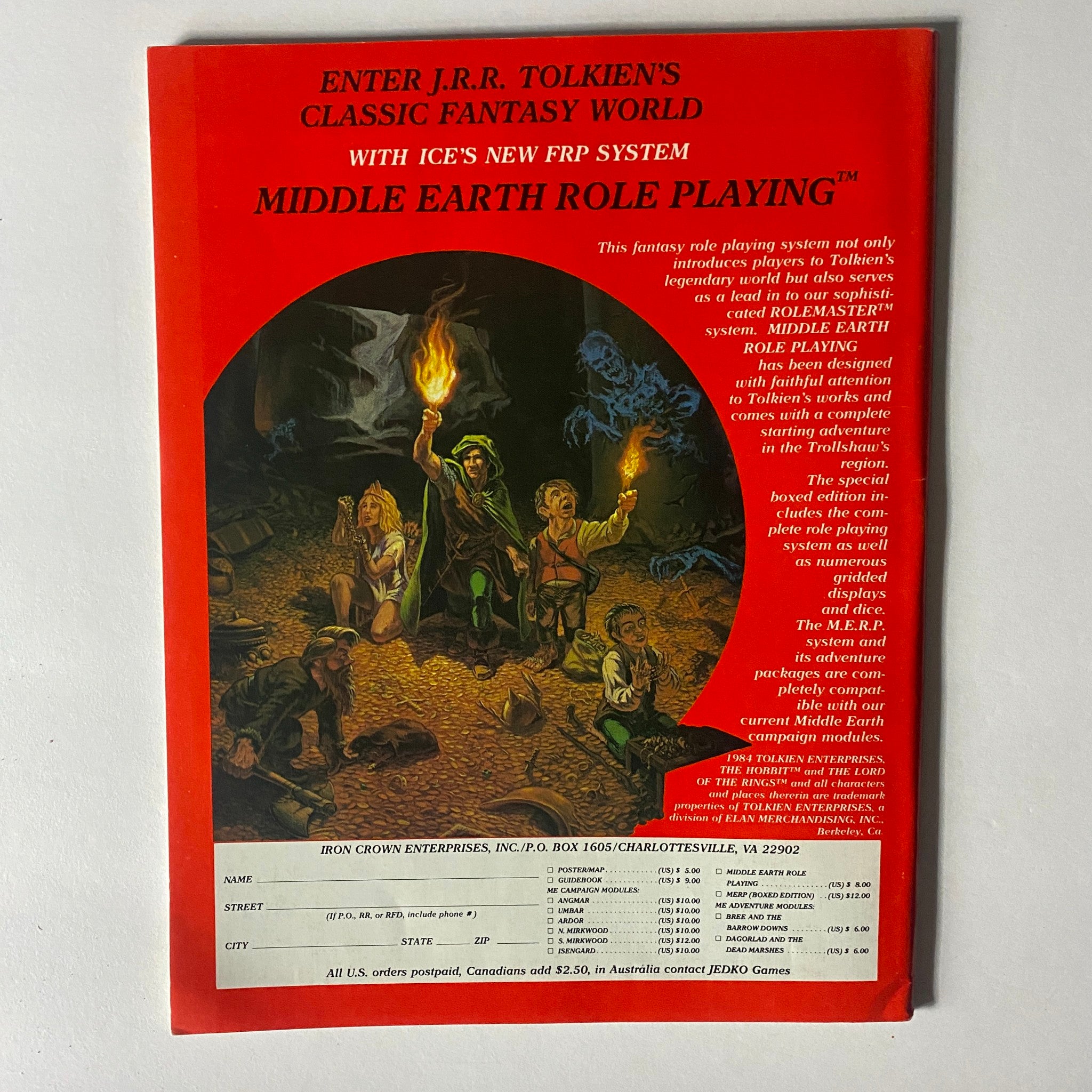Back cover of VTG Dragon Magazine May 1984 #85 advertising the Middle Earth Role Playing system with an illustration of adventurers in a fantasy setting.